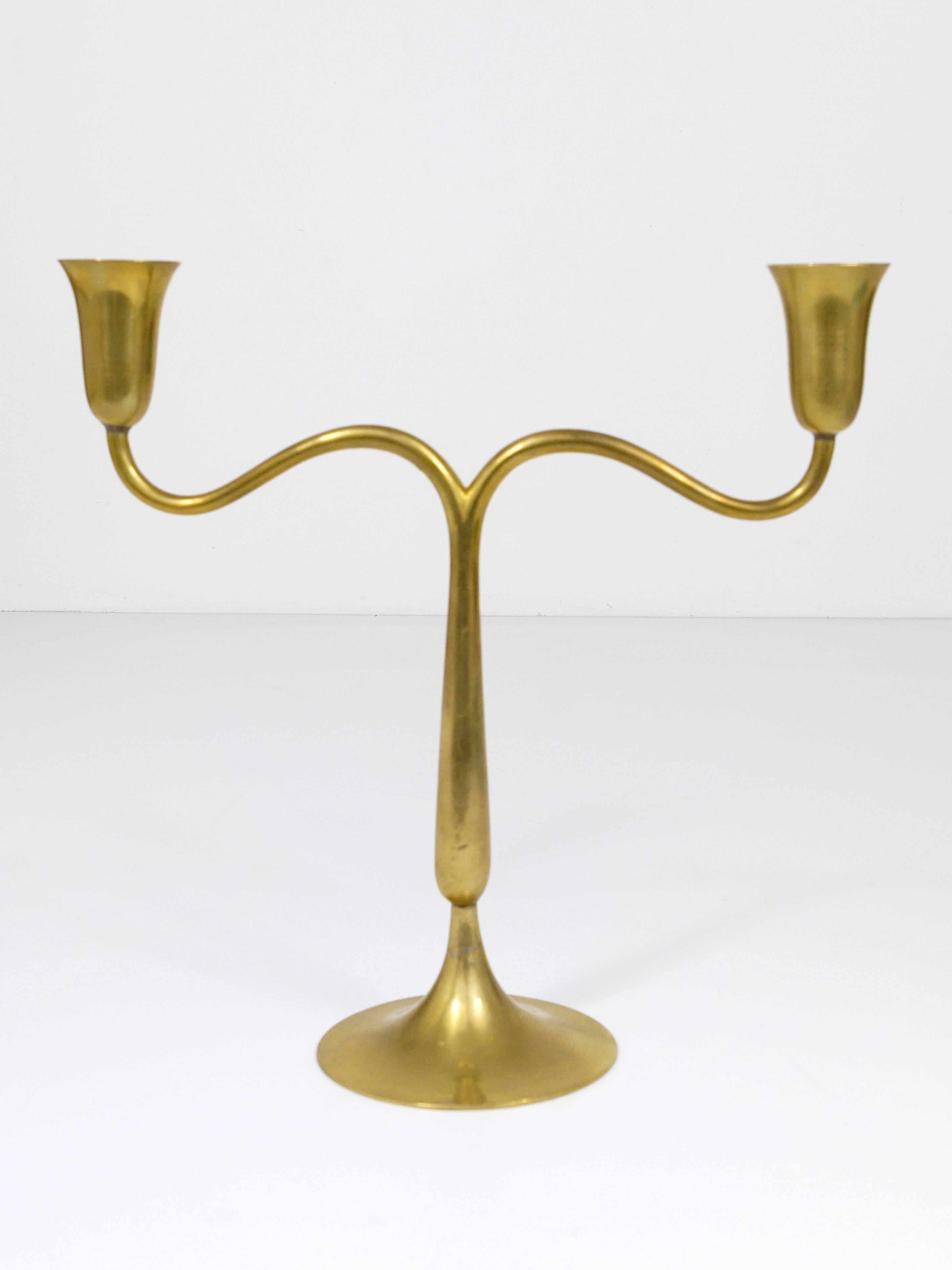 A beautiful Austrian two-arm mid century brass candleholder / candlestick, designed and executed by Karl Hagenauer / Werkstatte Hagenauer in the 1940s. In very good condition, marked on its bottom.
