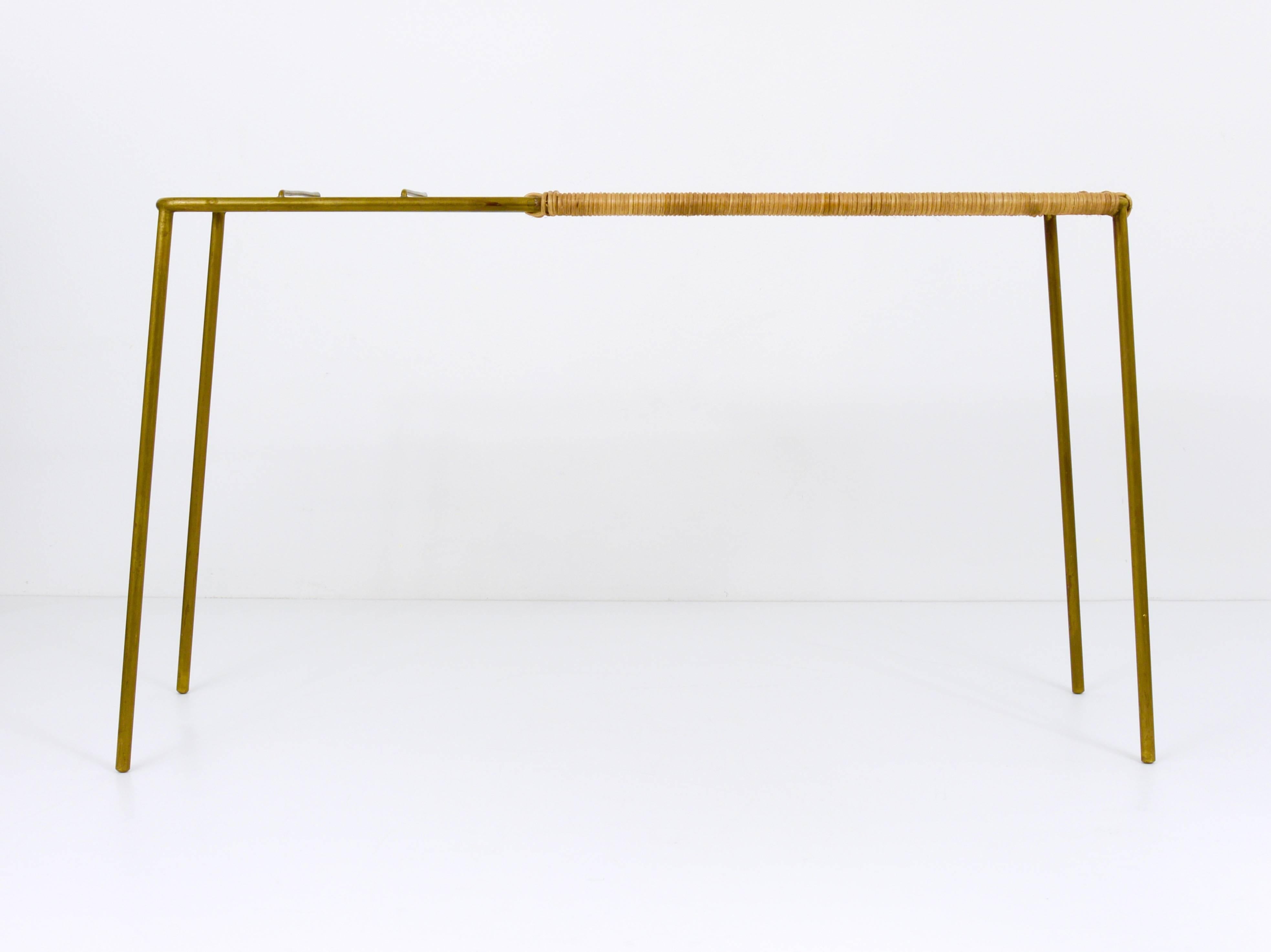 A beautiful console table or little bench with umbrella stand, made of brass and wickerwork. Designed and executed in the 1950s by Carl Aubock, Austria. In excellent condition. 