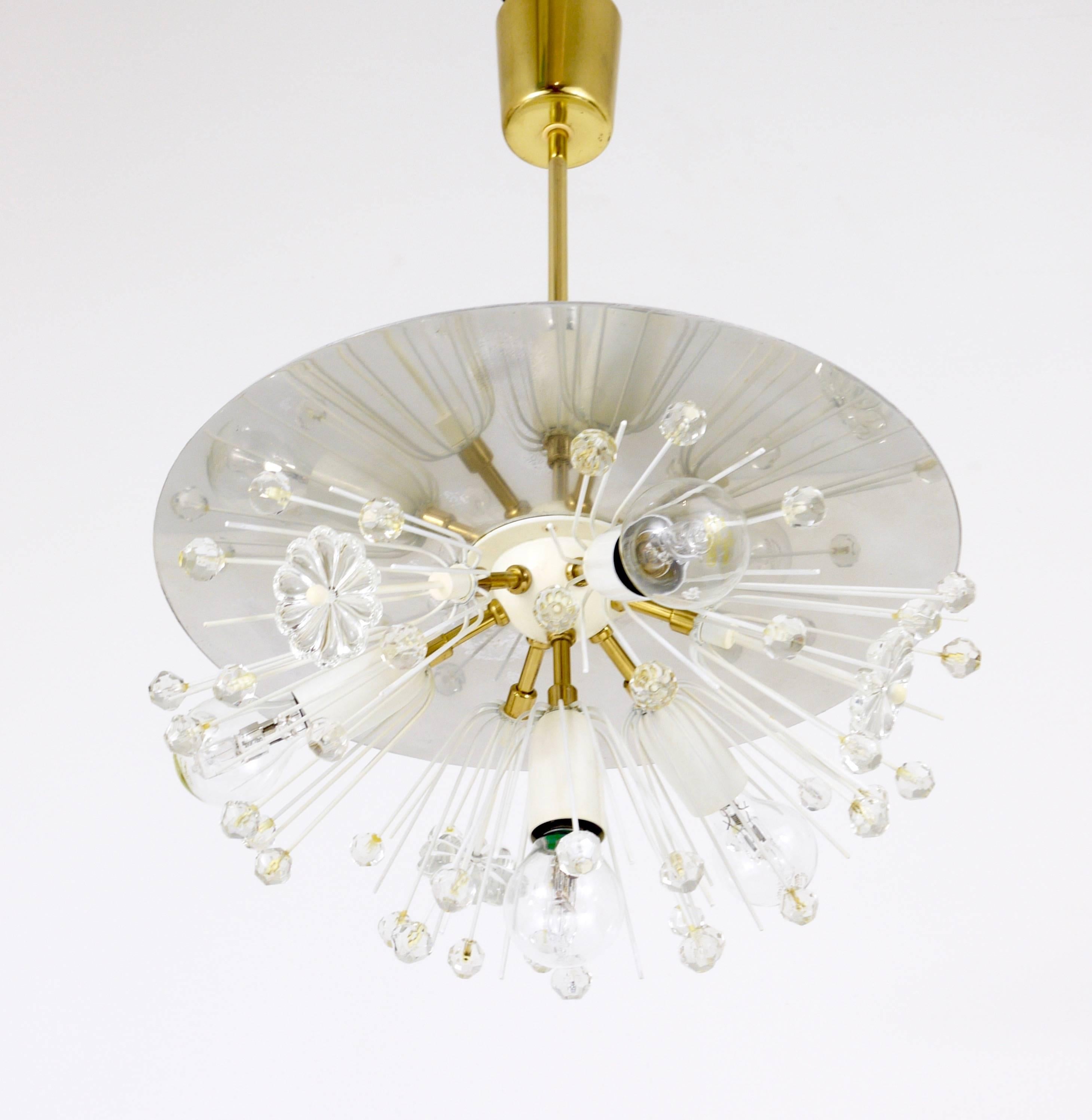 A beautiful and unusual hemispherical blowball snowflake dandelion sputnik chandelier, designed by Emil Stejnar, manufactured in the 1950s by Rupert Nikoll, Vienna. An early model with a white globe in the center and a nickel-plated reflector disc.