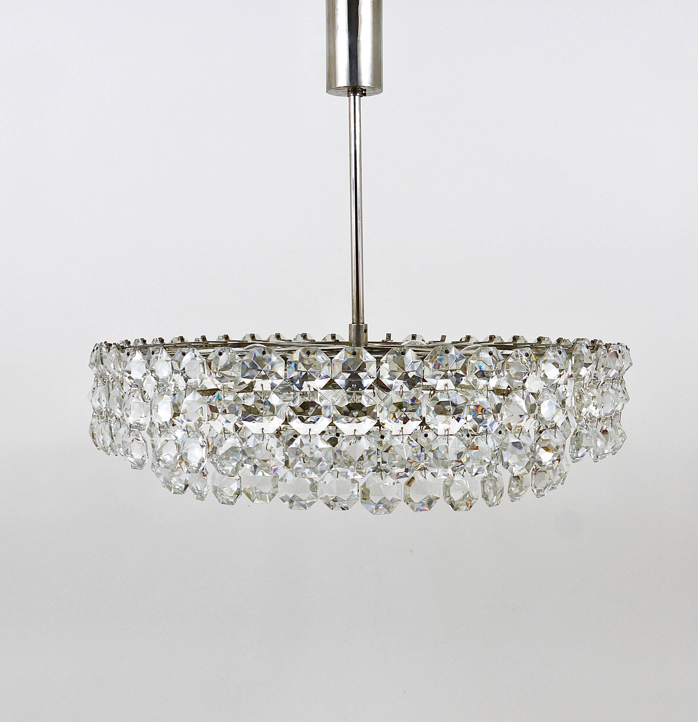 A beautiful, large nickel-plated brass crystal chandelier from the 1960s, manufactured by Bakalowits and Sohne, Vienna, Austria. The chandelier has a nickel-plated mirror-finished disc in the center and two tiers, covered by big, octagonal