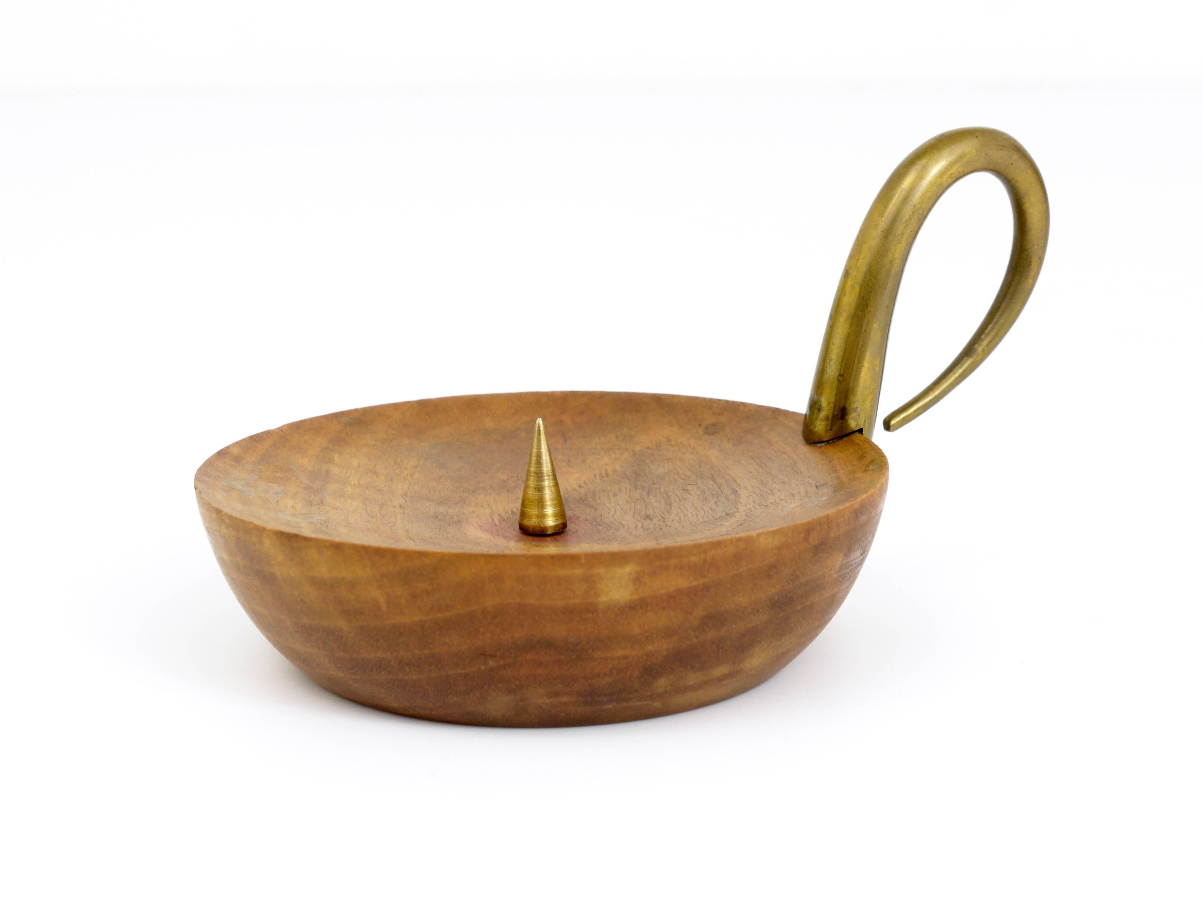 A beautiful modernist candleholder, made of walnut and brass, designed an manufactured by Carl Auböck, Austria, Vienna, in the 1950s. In very good condition.