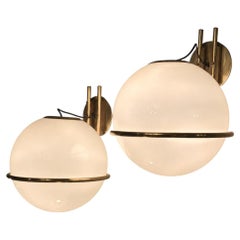 Pair of brass and glass wall sconces from 1960s Italy.