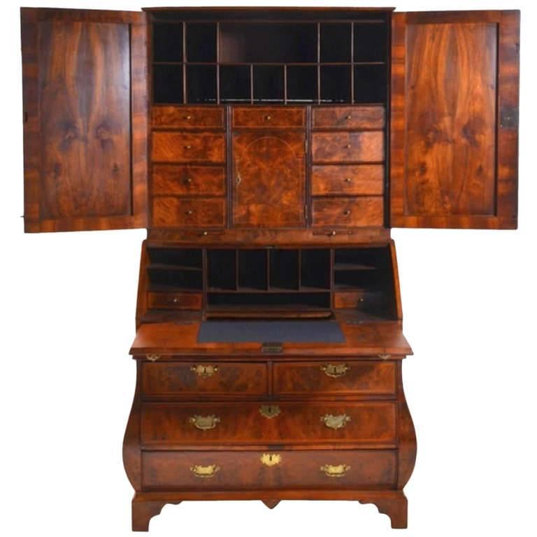 SPECIAL SPRING SALE! 

A superb (because of its height unique (!) George one figured (burr-) walnut and inlaid bombed Dutch secretaire / bureau bookcase (scriban) with book matched veneers of the finest quality. The fall- front enclosing a fitted