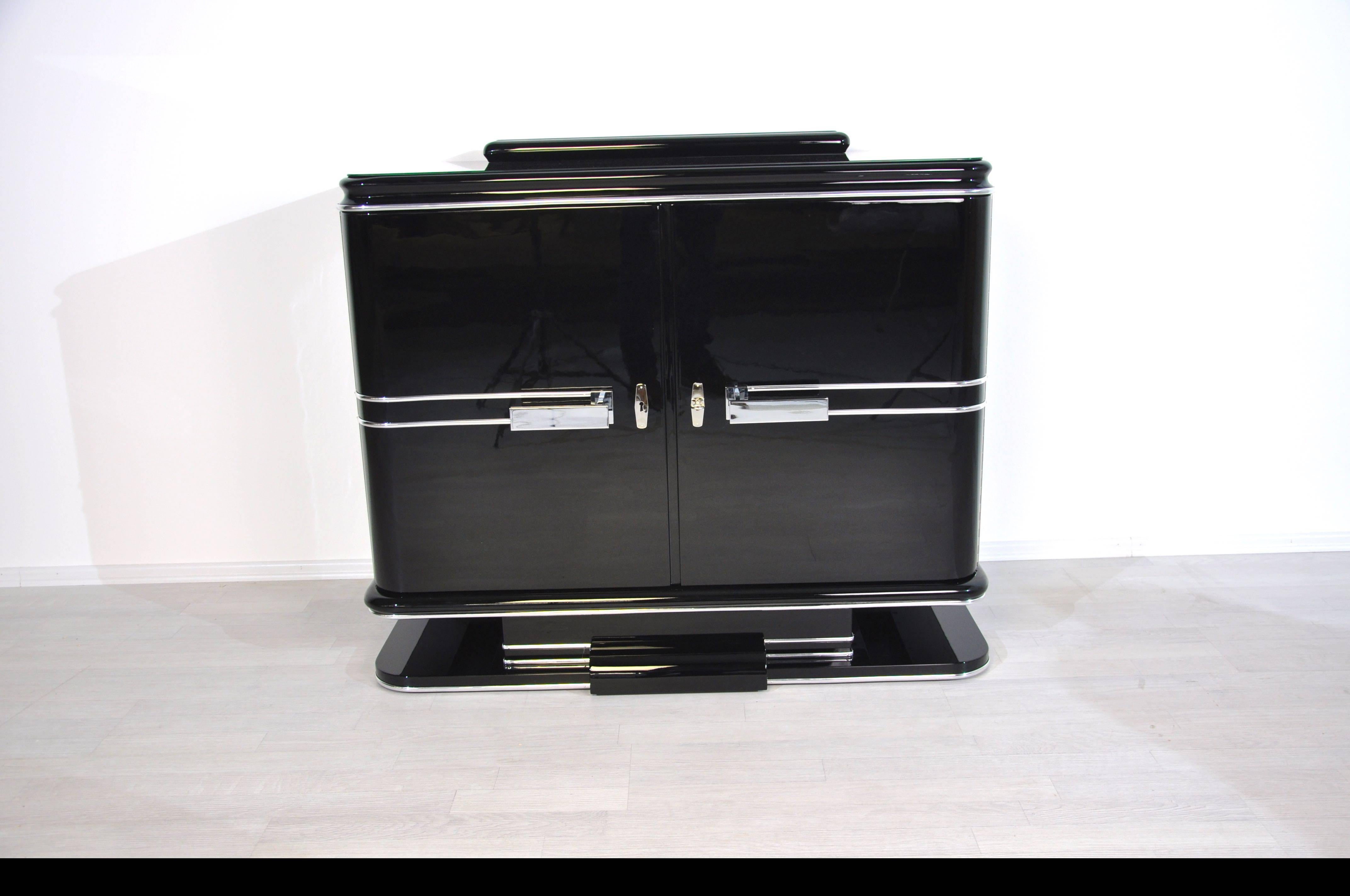 Wonderful chrome commode from the French Art Deco. With large chrome handles and fine details. A true masterpiece of craftmanship with only high quality materials. Interior is painted in matt black. The great body shape is complemented by elegant