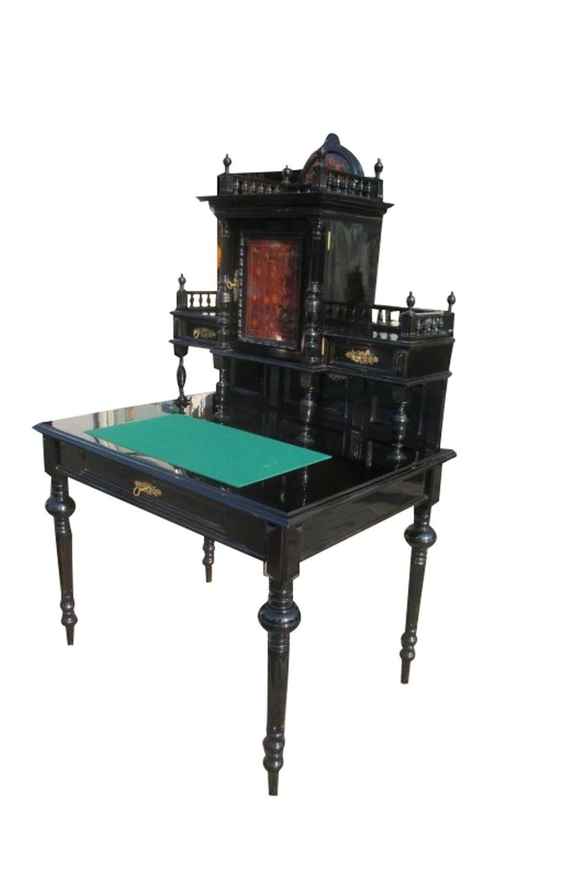 A black ladies desk from the founding period. This unique piece offers a outstanding design with lots of ornaments. Surface is newly painted and polished in high gloss black. The small door of the bit on the top is veneered in palisander and very