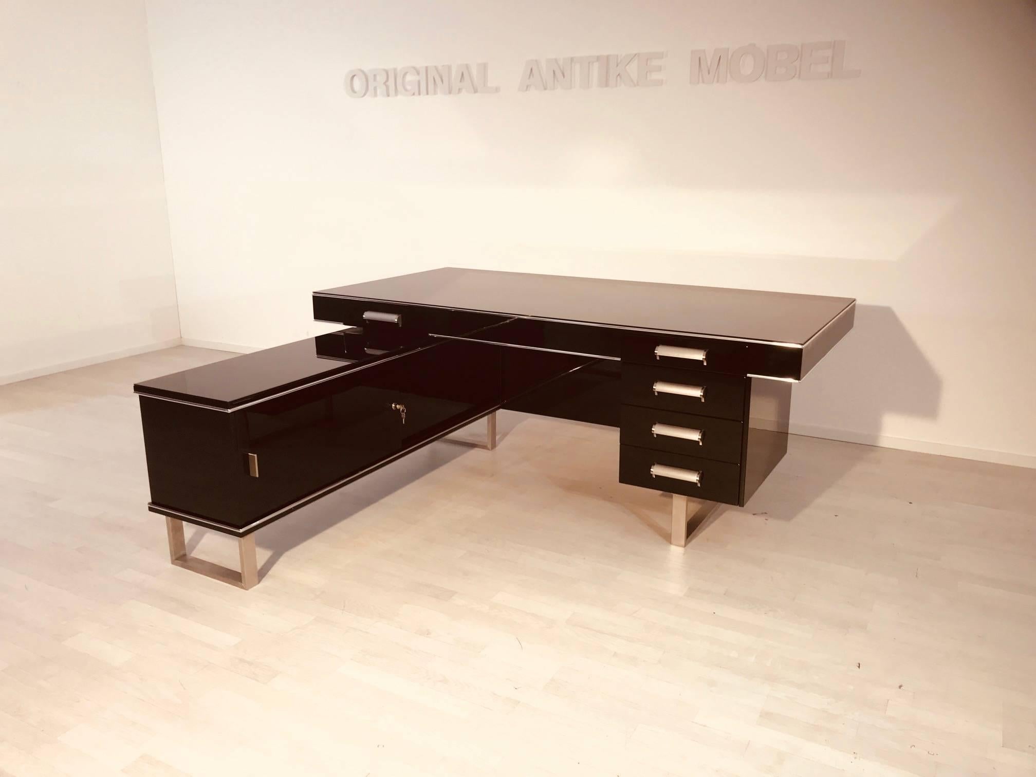 Bauhaus corner desk or partner desk. Simple body language und straight lines determine the design of this great piece of furniture! Wonderful straight body. Black high gloss lacquer. Chrome bars. Plenty of storage space with five drawers and a big