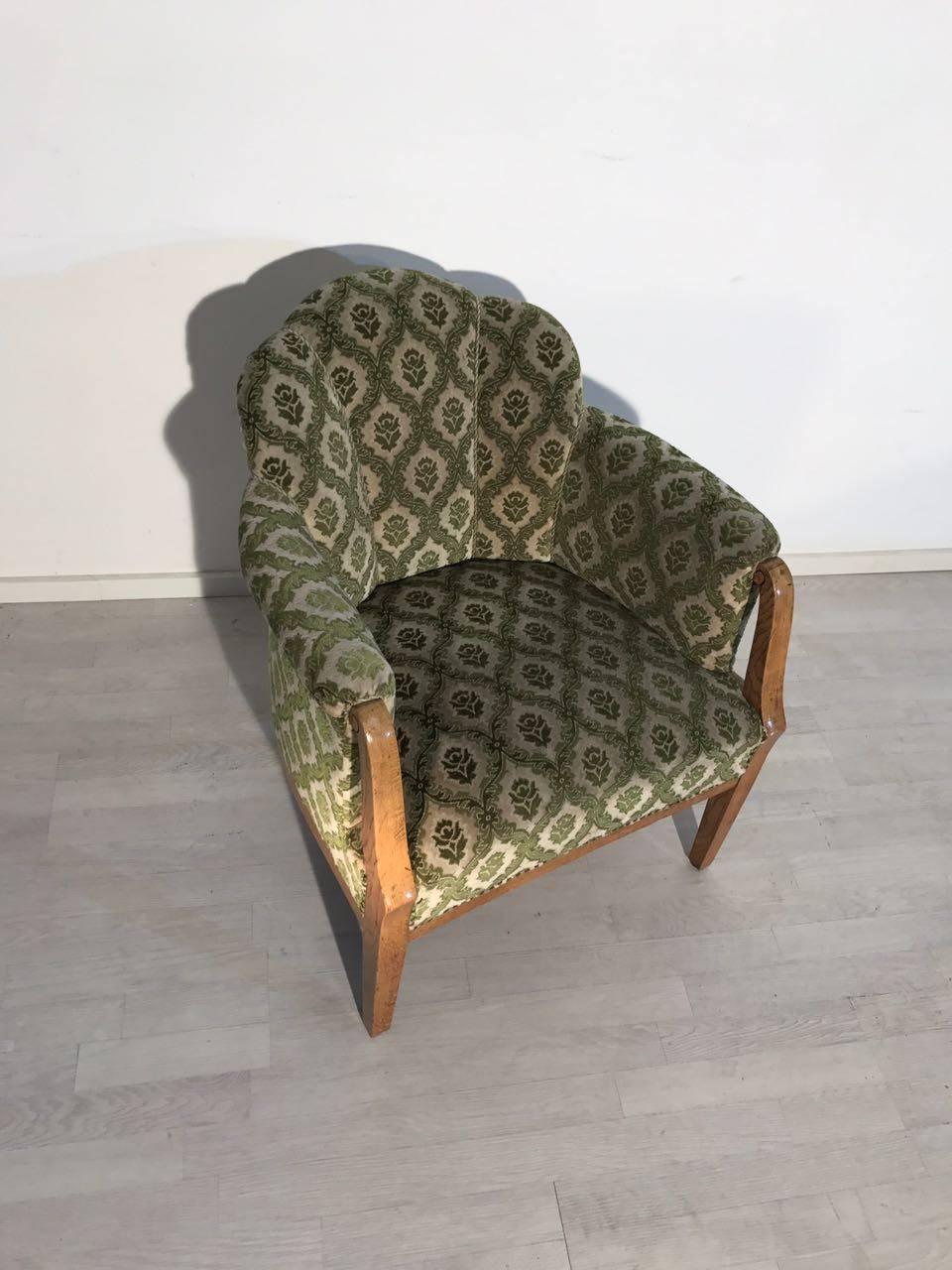 A vintage armchair from the Art Deco era. The armchair shines with a beautiful, striking fabric pattern. It convinces through a wonderful and comfortable body and is perfect for any purpose! A wonderful design which is typical for the Art Deco