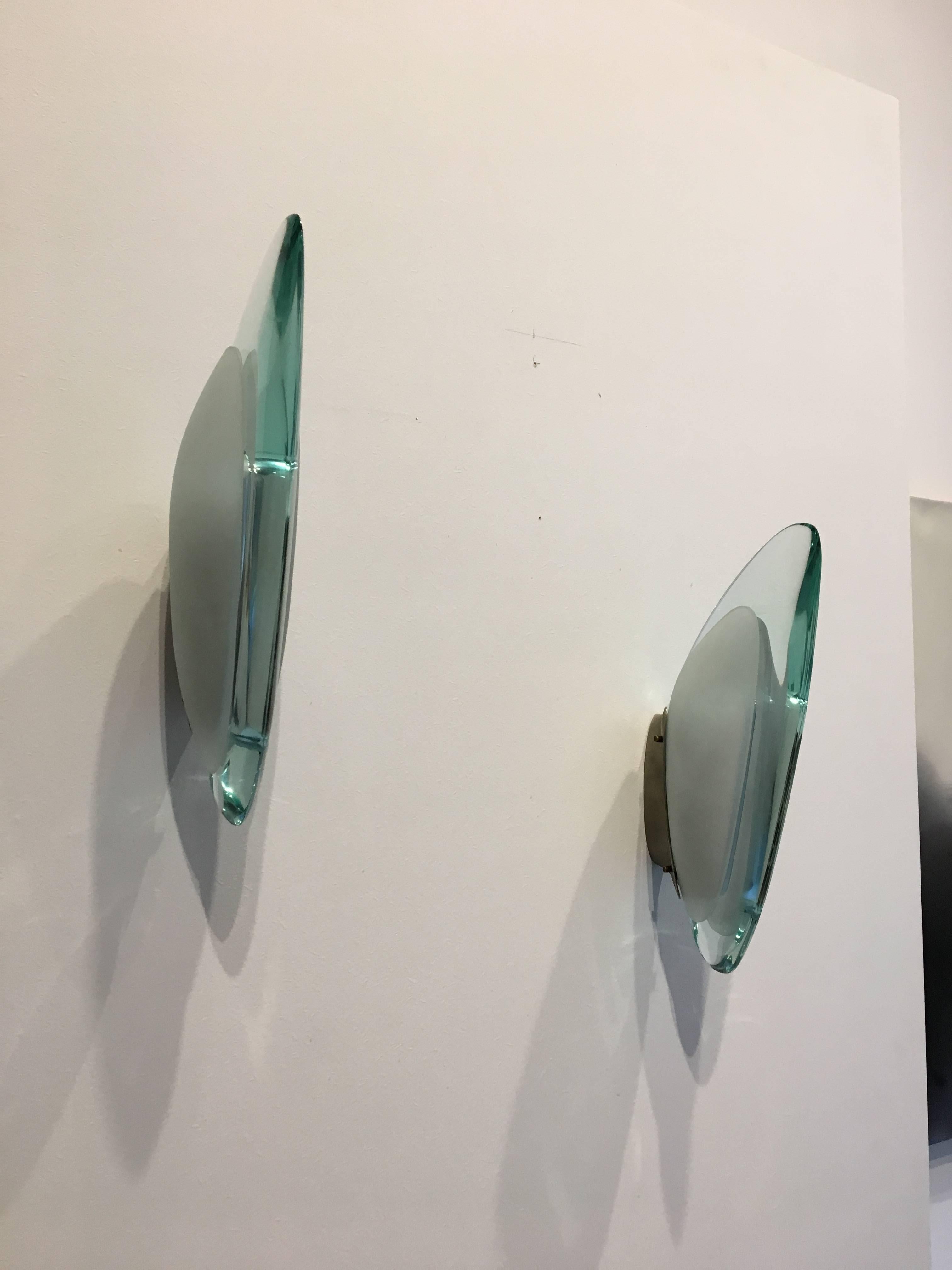 A pair of wall sconces, by Max Ingrand for Fontana Arte.
