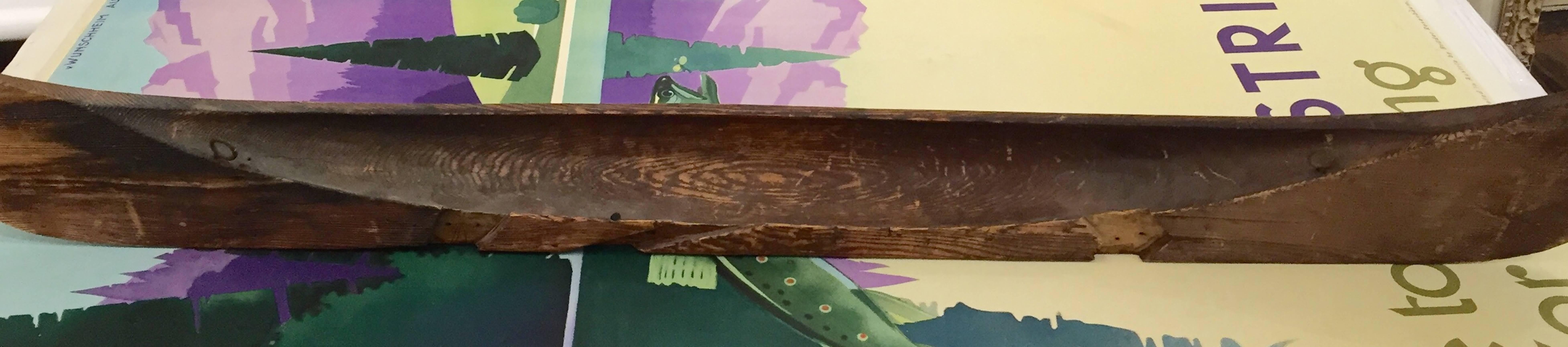 19th century wall hanging model of a canoe with great carved decoration.