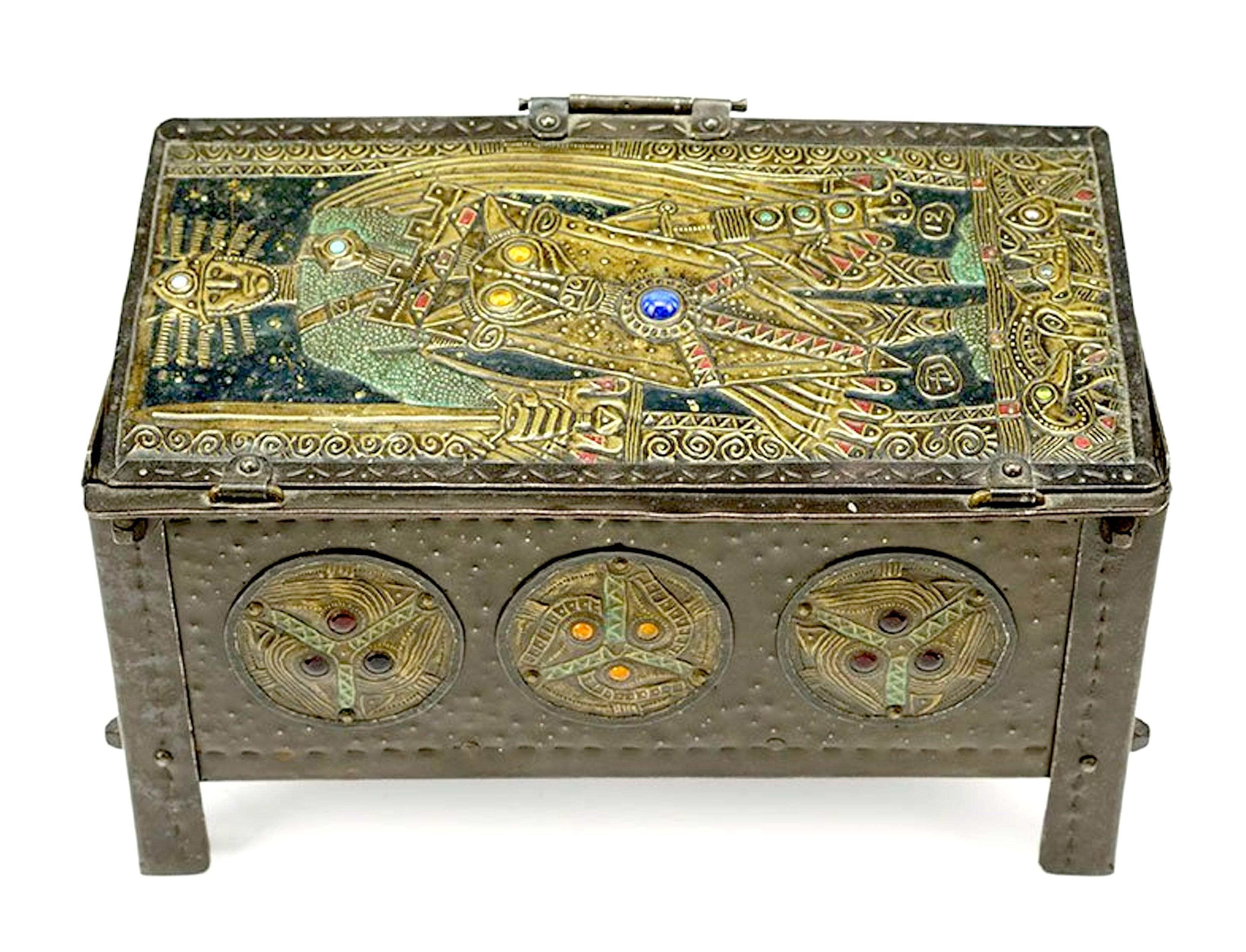 Metal repousse with glass cabochons,

Alfred-Louis-Achille Daguet was a metalsmith who specialized in repoussé copper panels made for application to hinged boxes, mantel clocks, picture frames, album covers, and elements of desk sets. His