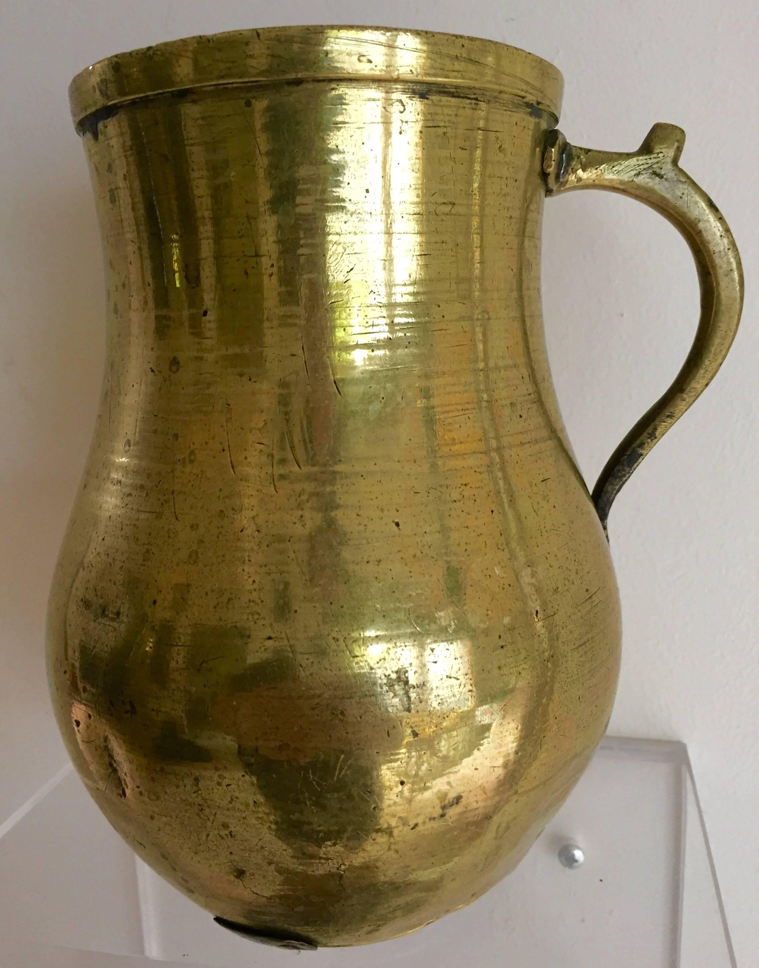 Early Continental brass tankard with character. Great rivets and early repairs.