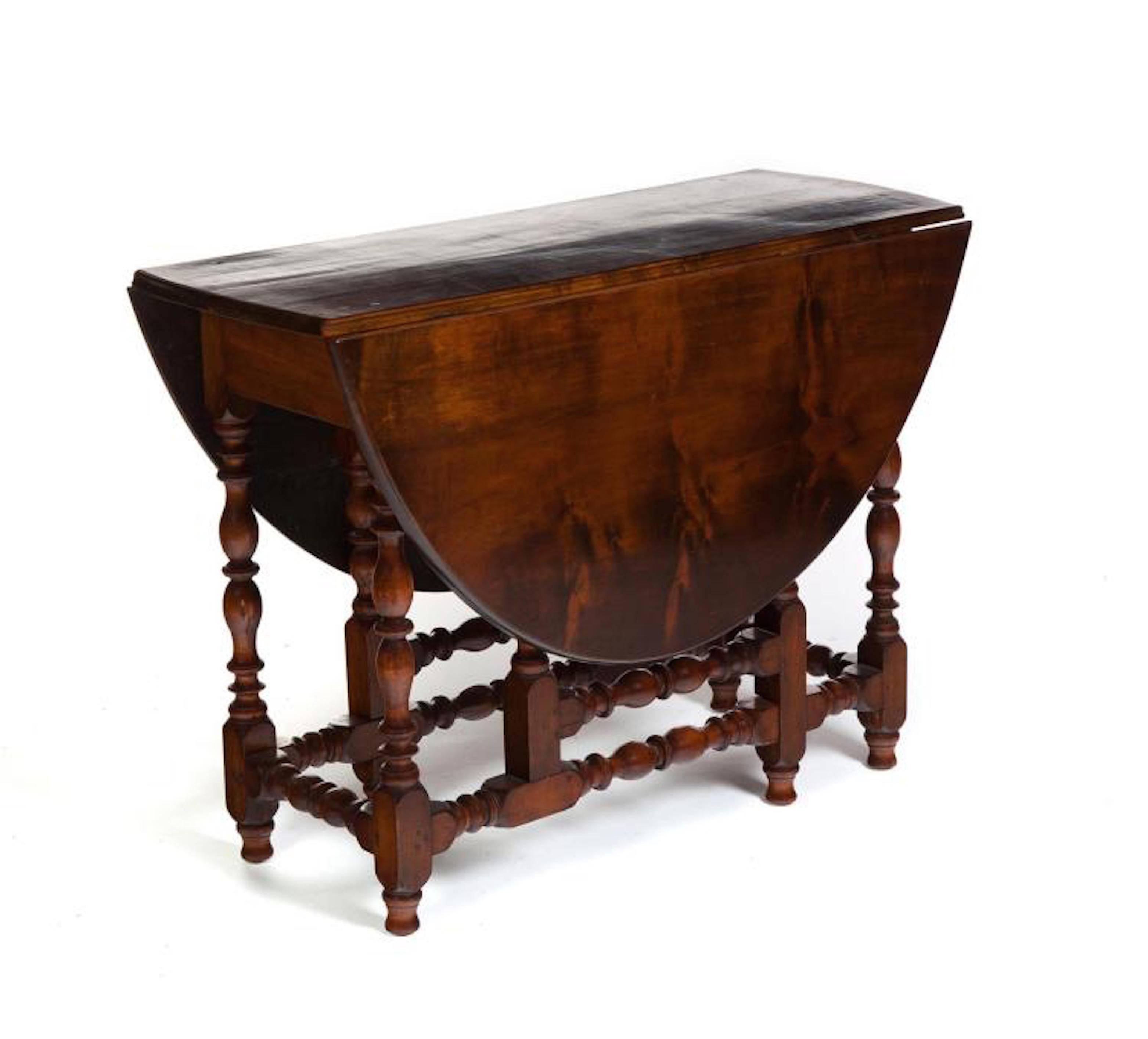 Good turnings, shaped leaves and single drawer with wide dovetailing.