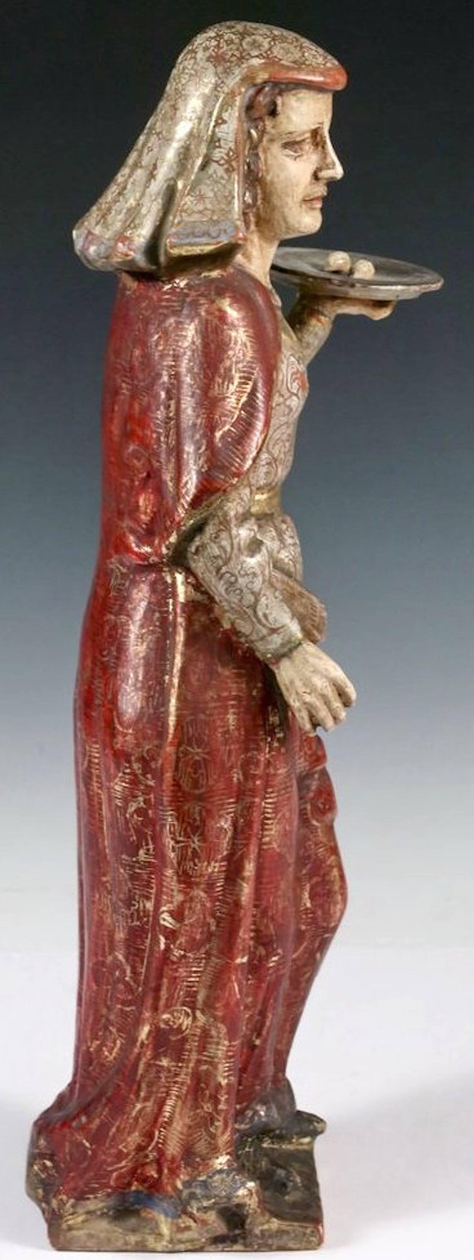 She is depicted holding a tray aloft with her eyes, which she gouged out in order to keep from being married off to a Pagan. Polychromed gesso with gilding.  Some small bits of polychrome missing off the back, as seen in the images.  