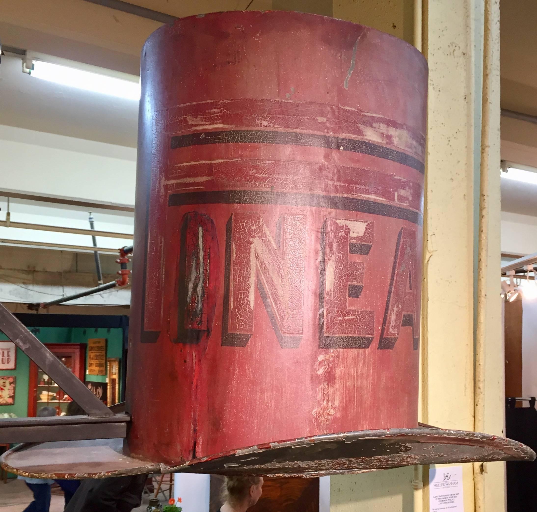 Large painted zinc trade sign in the form of a top hat 19th century. Retains a great old red surface.