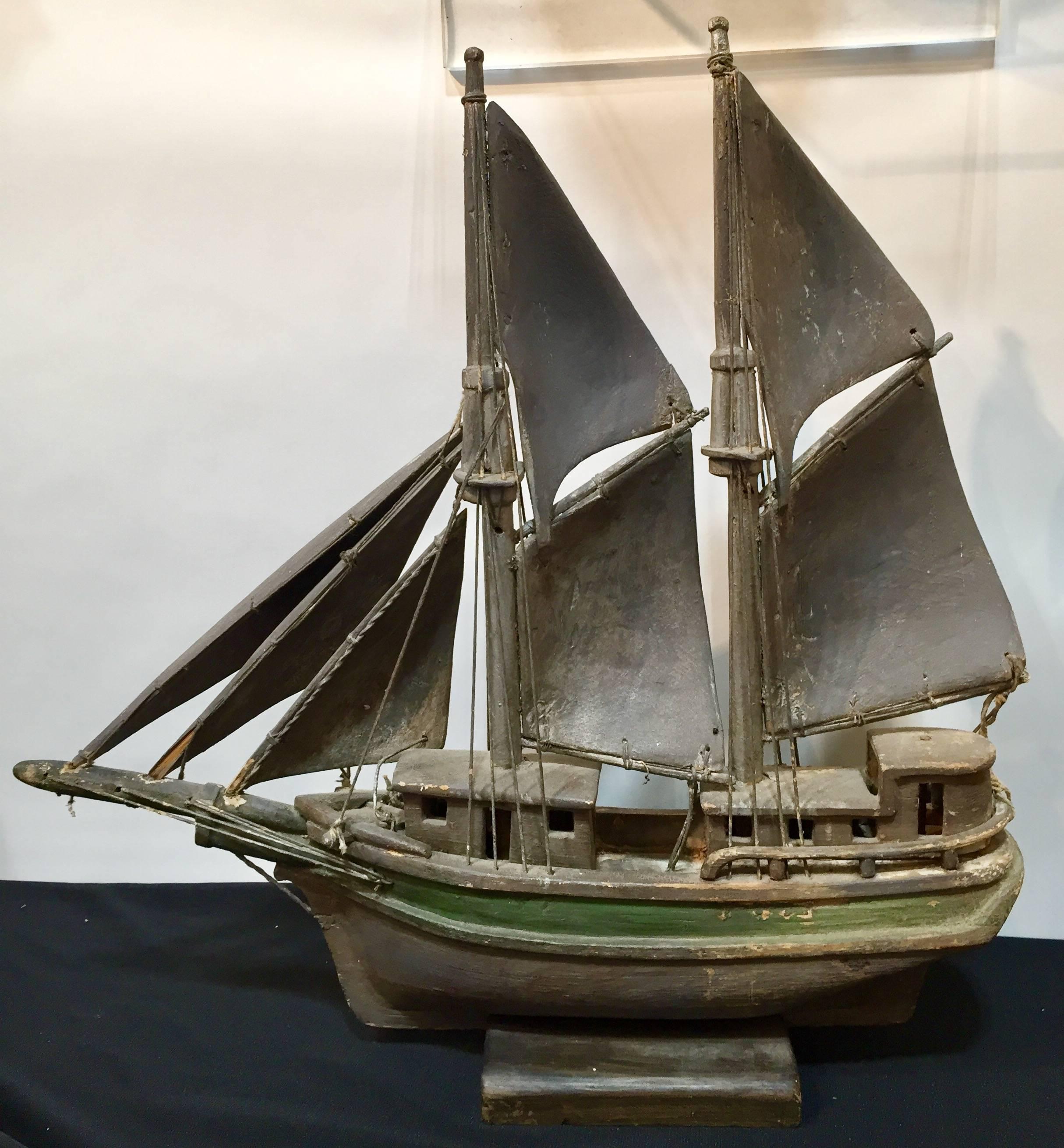 Handmade painted wood model of a schooner, found in Maine.