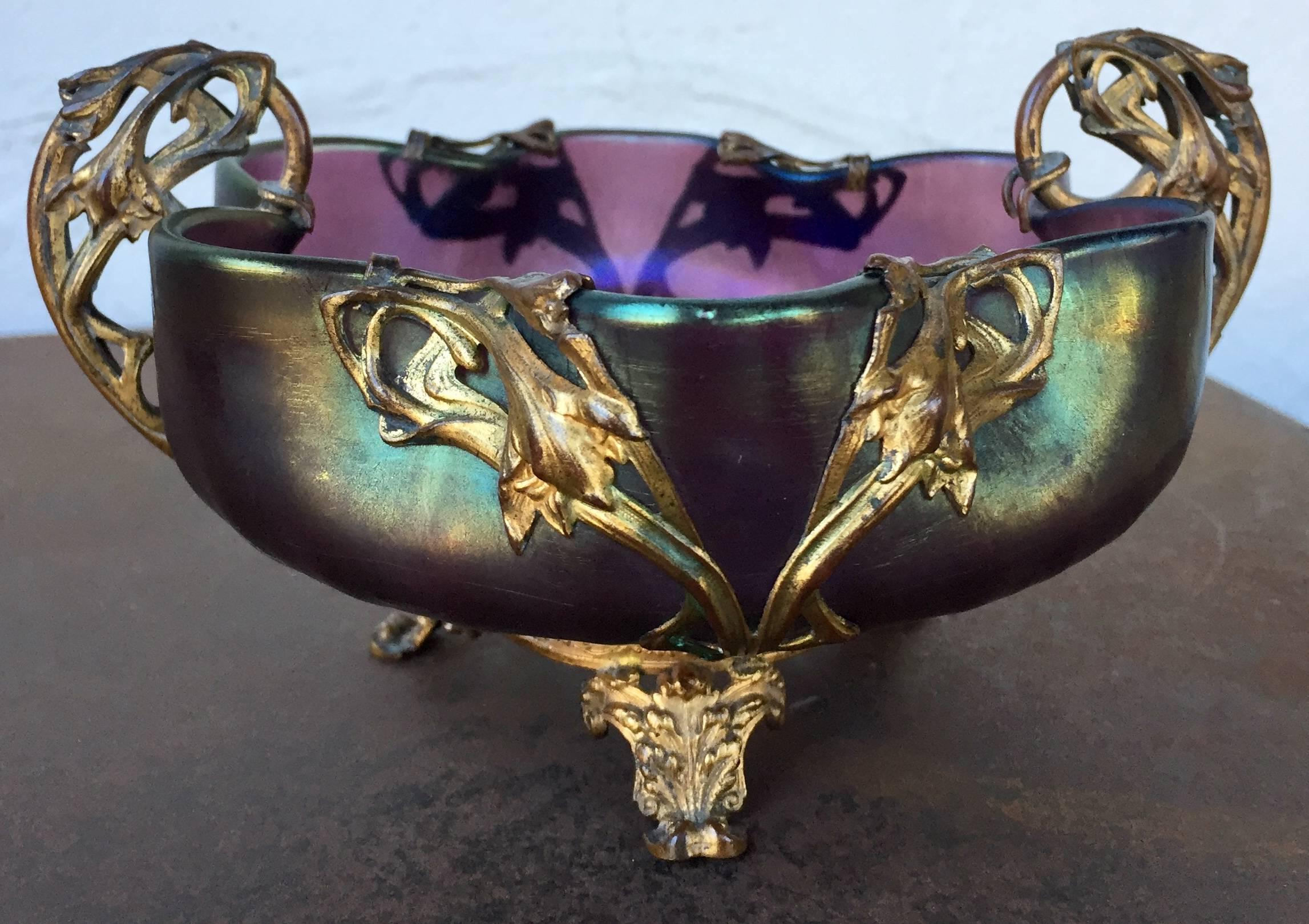 Czechoslovakian-Rindskopf Lucien glass bowl, in gilt doré mount with tripod ornate base, two scrolled and detailed handles, in style of Marcel Bing (1875-1920). Measures: 6.25