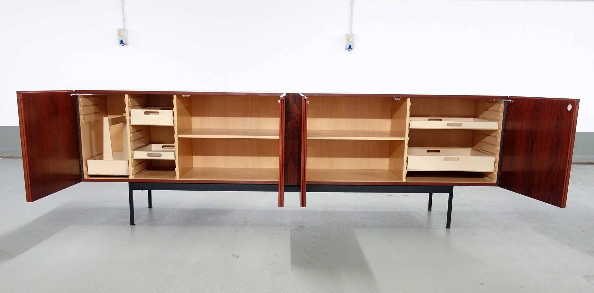 Mid-Century Modern Sideboard, rosewood exterior, maple interior. Black lacquered iron base.
Design: Dieter Waeckerling 1959,
Producer. Erwin Behr Moebelfabrik, Germany.
Original vintage condition with some traces of use to the edges.
l. 248, d.