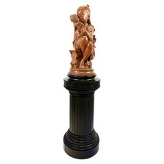 Una encantadora escultura de terracota patinada de finales del siglo XIX.