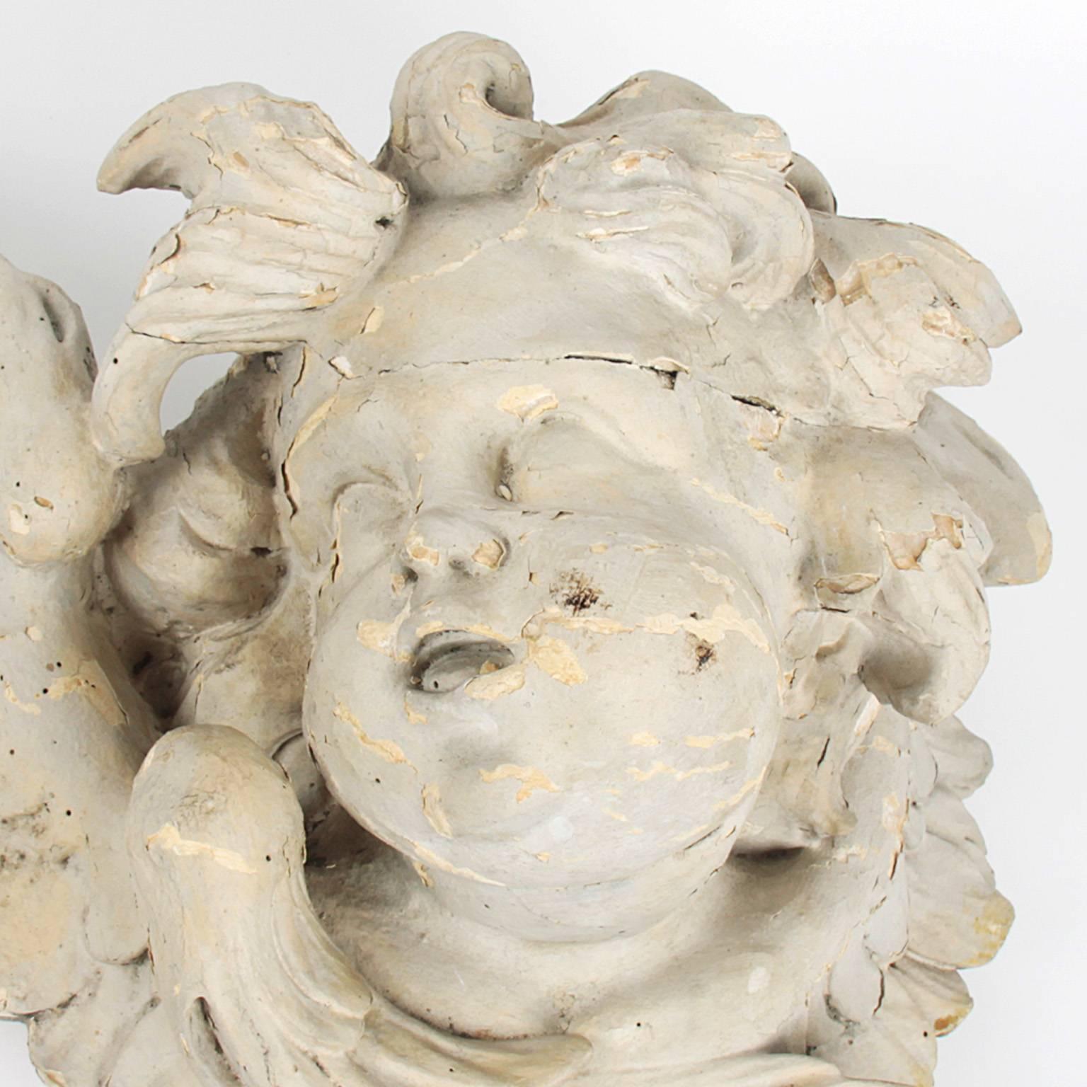 17th century wooden head of an angel.