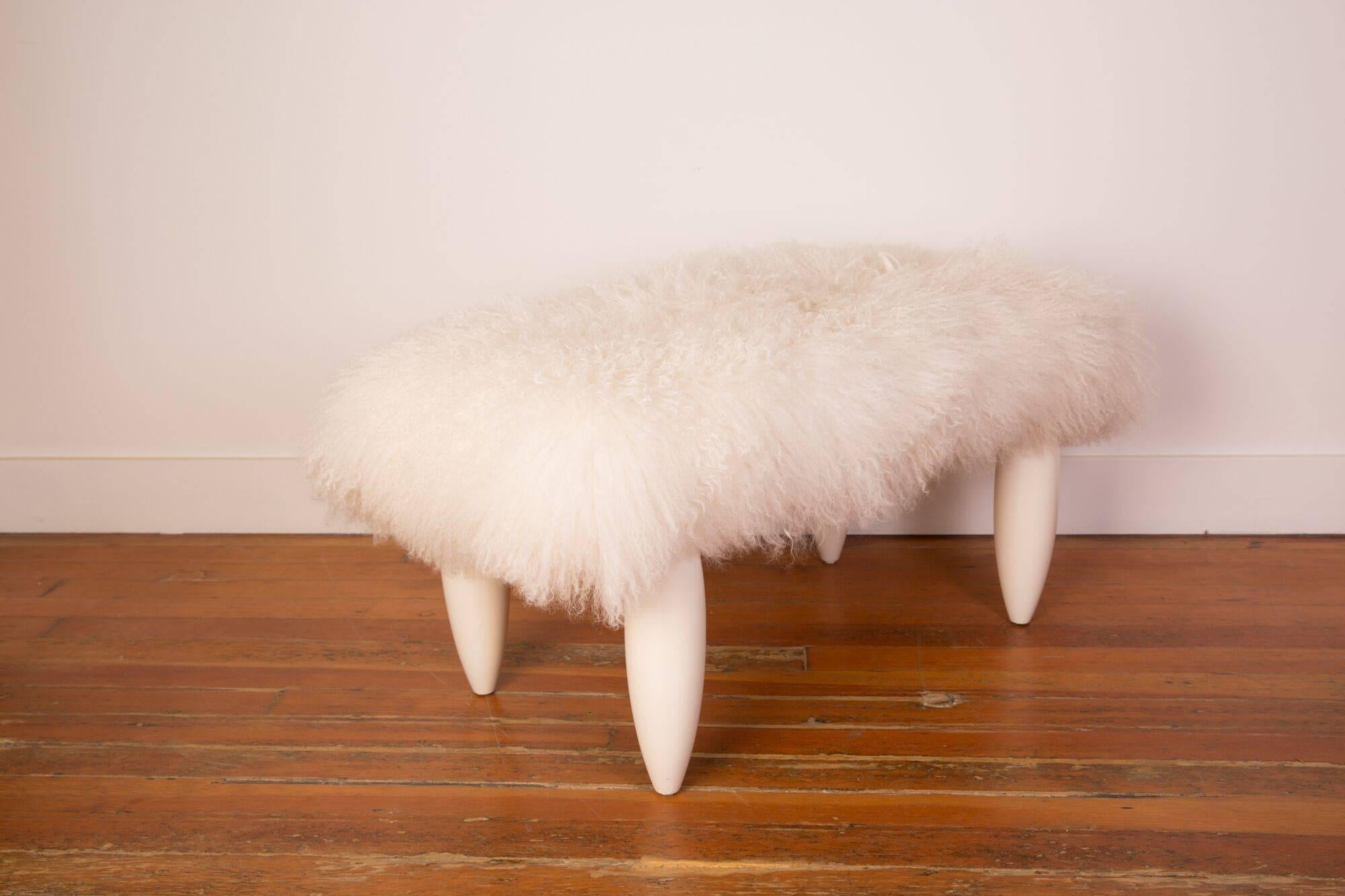 White lacquered frame with a white Mongolian fur seat.