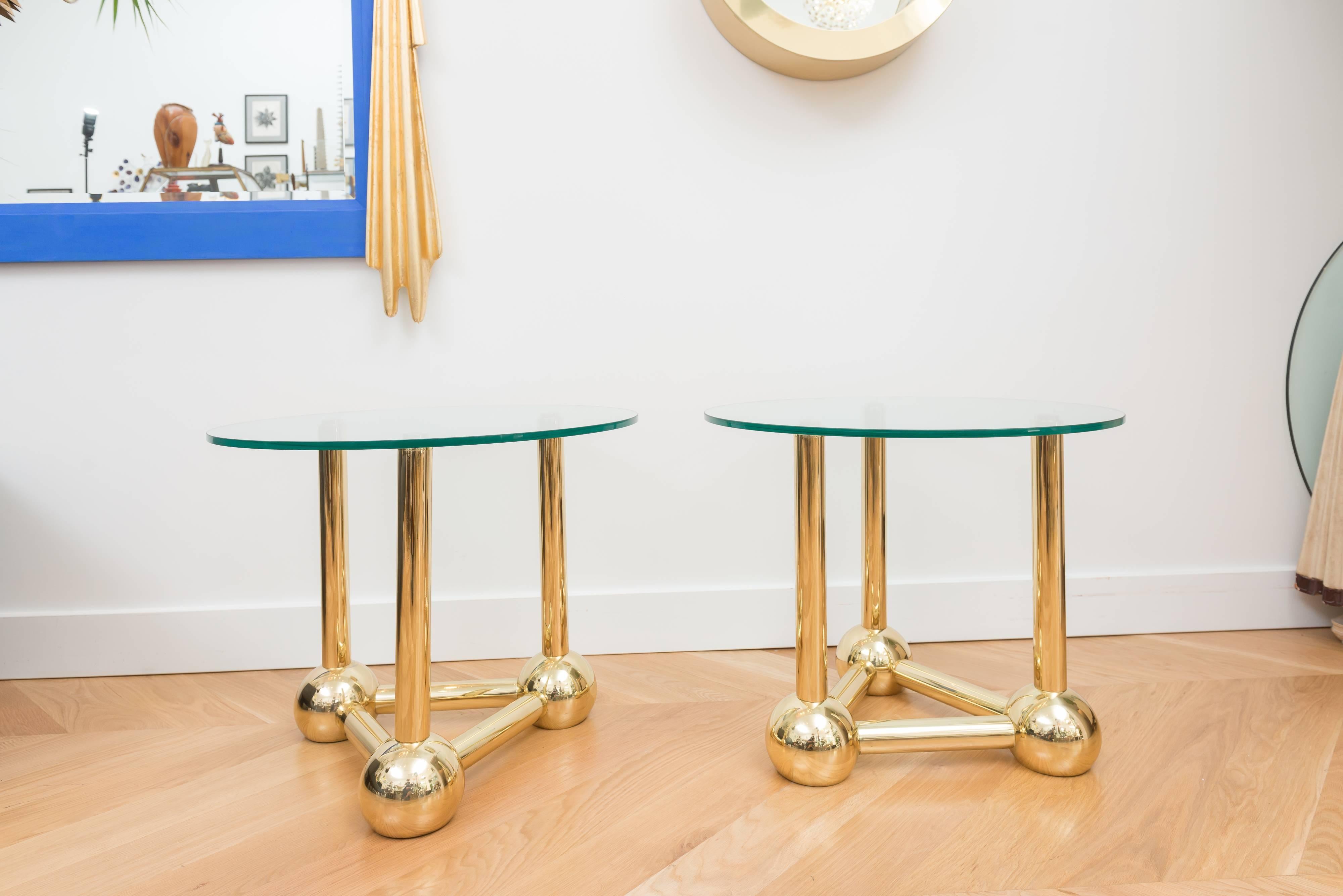 Pair of beautiful brass-plated side tables with glass tops.