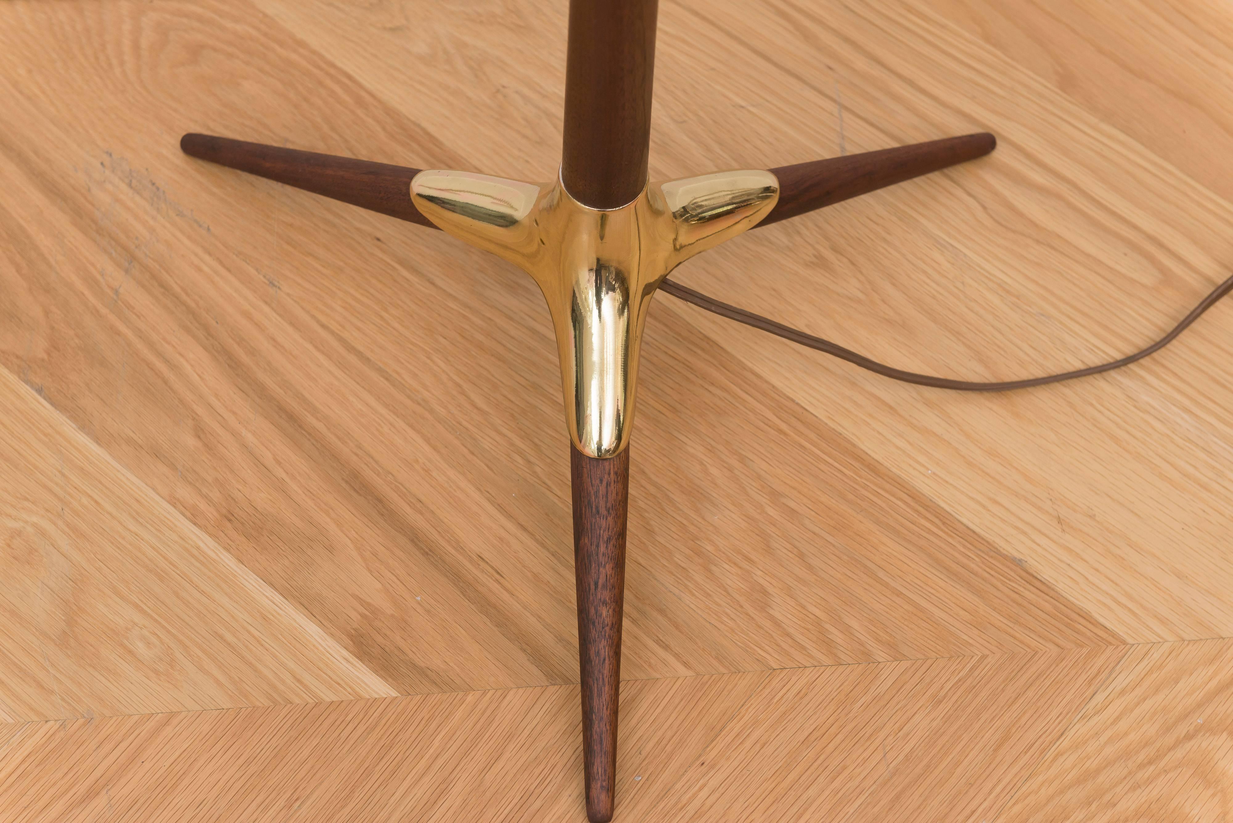 Completely restored tri foot brass and walnut floor lamp.
