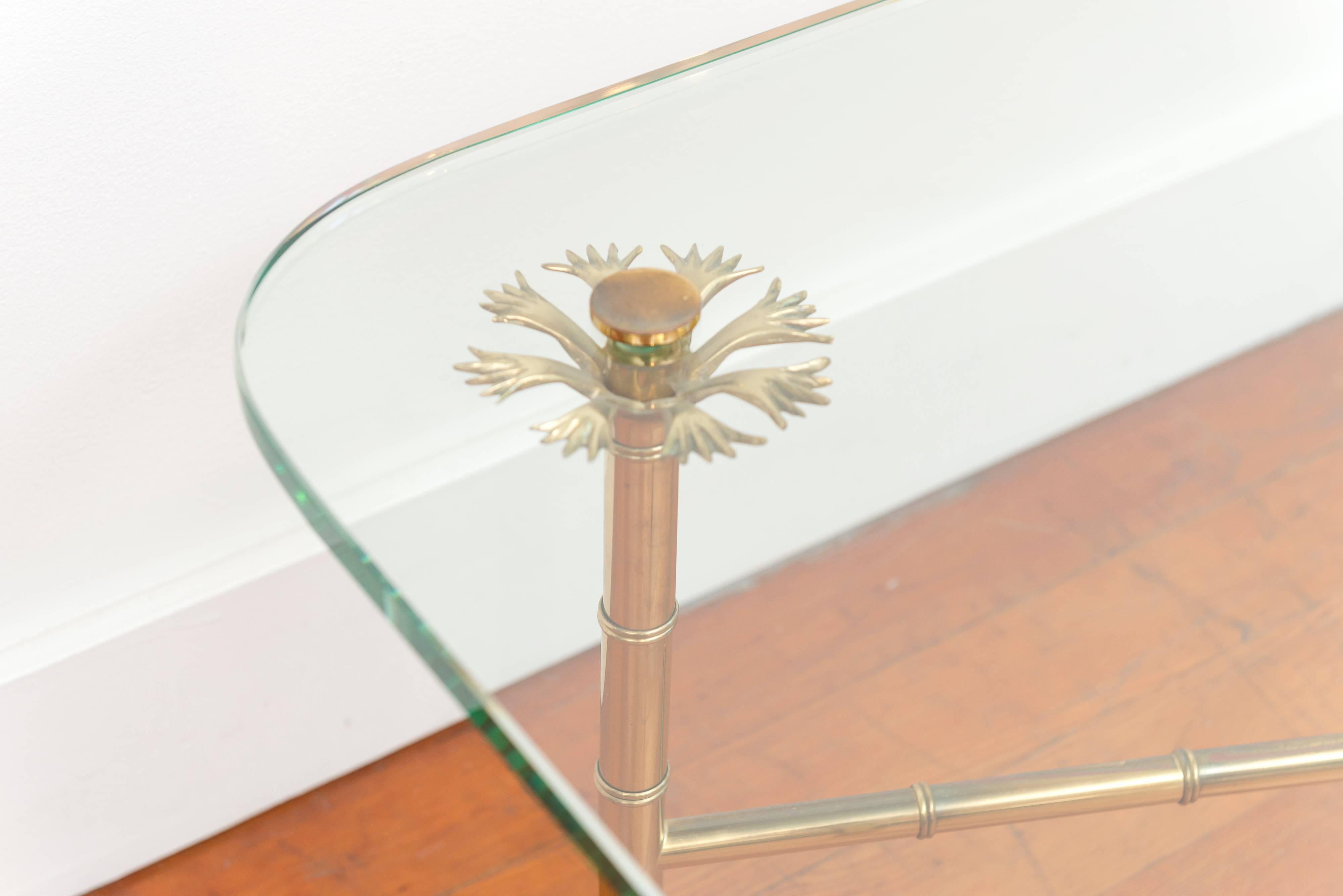 Italian brass and glass cocktail table. Its the perfect size if your limited on space, but more than make up for in style.