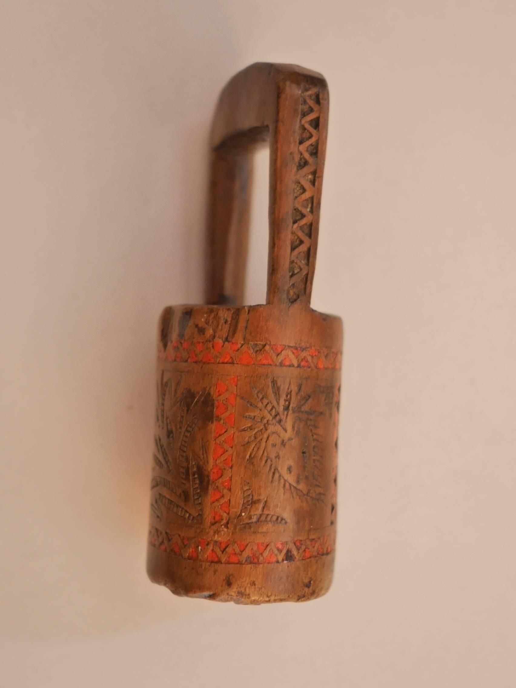 Nice little polychrome monoxyle bread stamp displaying a Fine work of marquetry with small inlays of colored wooden triangles, delicate engraved decorations and a carved flower on the bottom part. 

Bread and butter were the basics of French folks