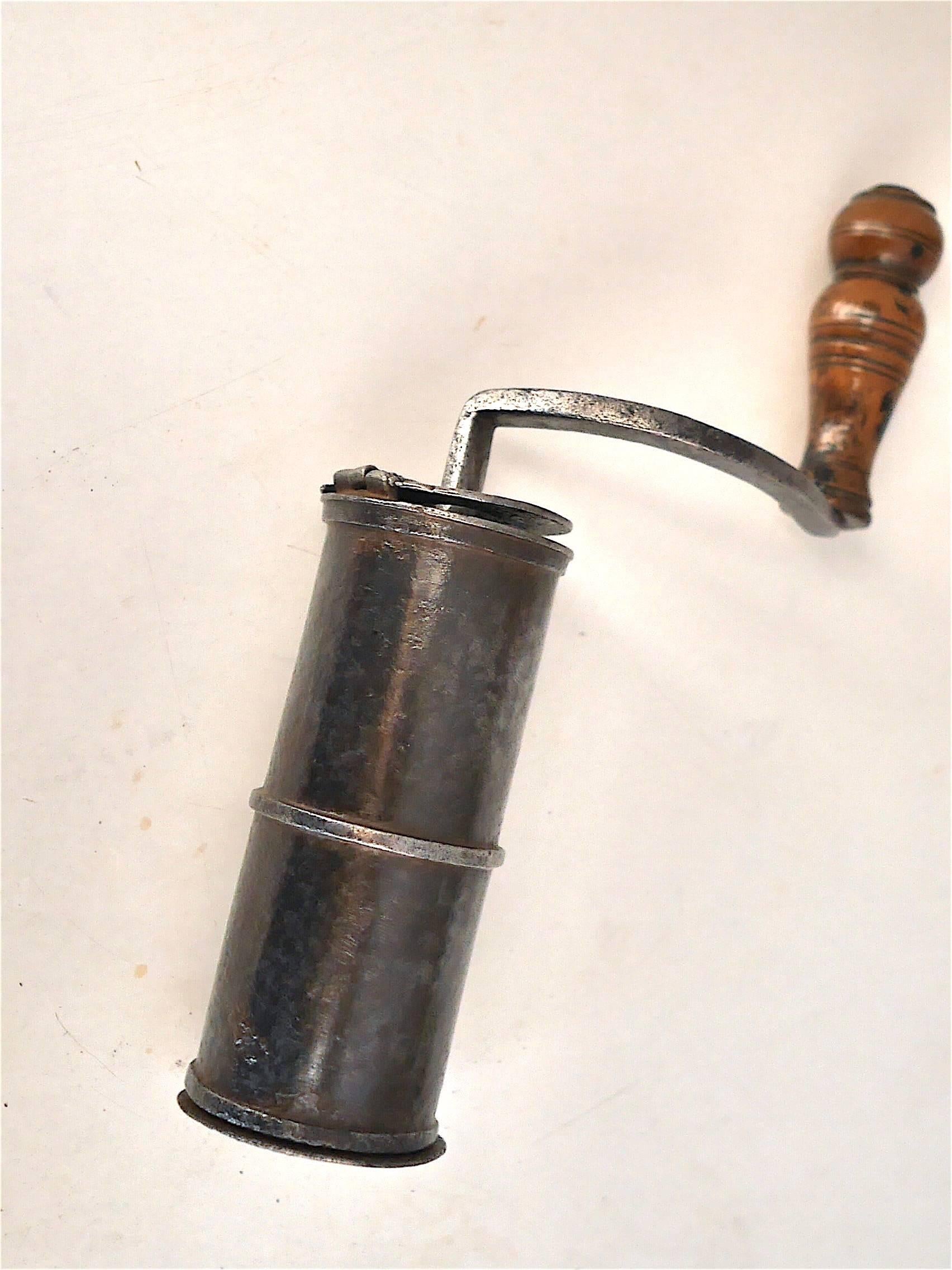 Early 18th century wrought iron pocket coffee grinder, attributed to Jean Blan.