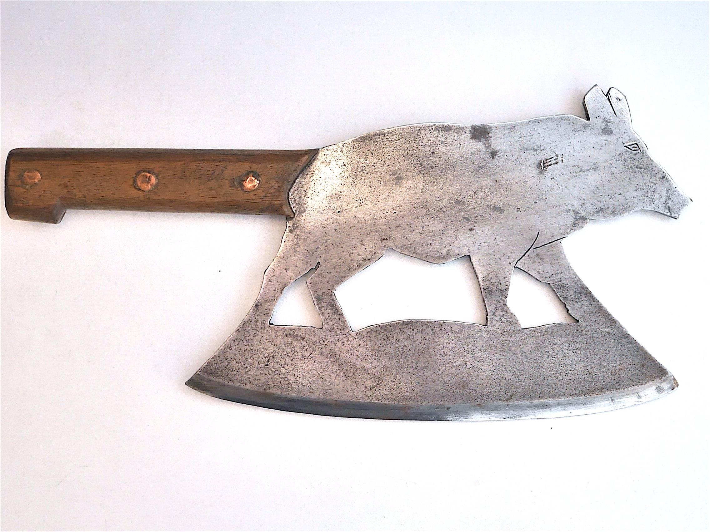 20th century cast Iron cleaver featuring a boar, France.