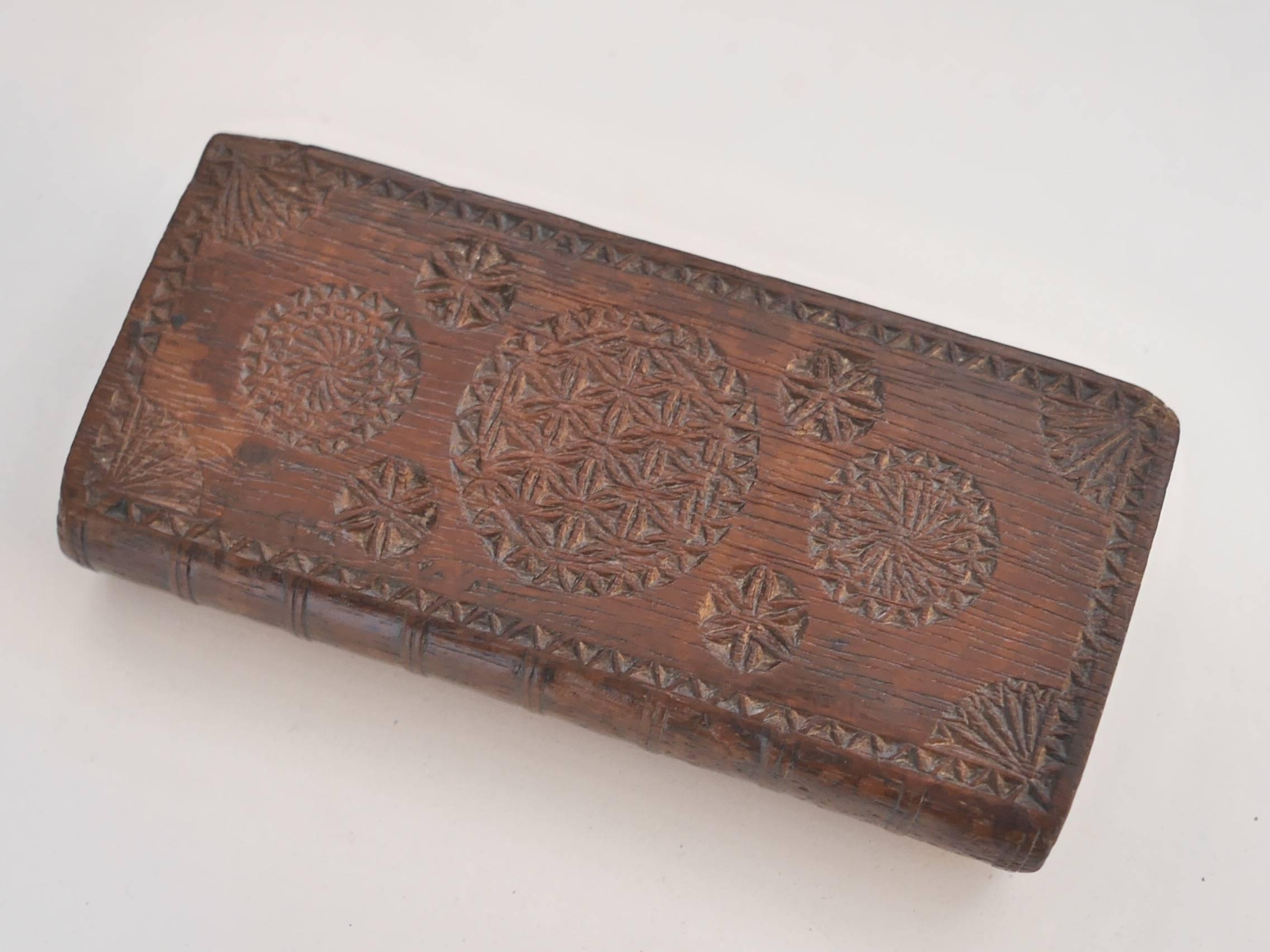 Beautiful Alpine 18th Century oak tree carved missal box, finely and precisely engraved with typical French Savoie details as hearts, rosaces and rouelles.  The box has the shape of a little book, one side opens with a sliding lid, the other