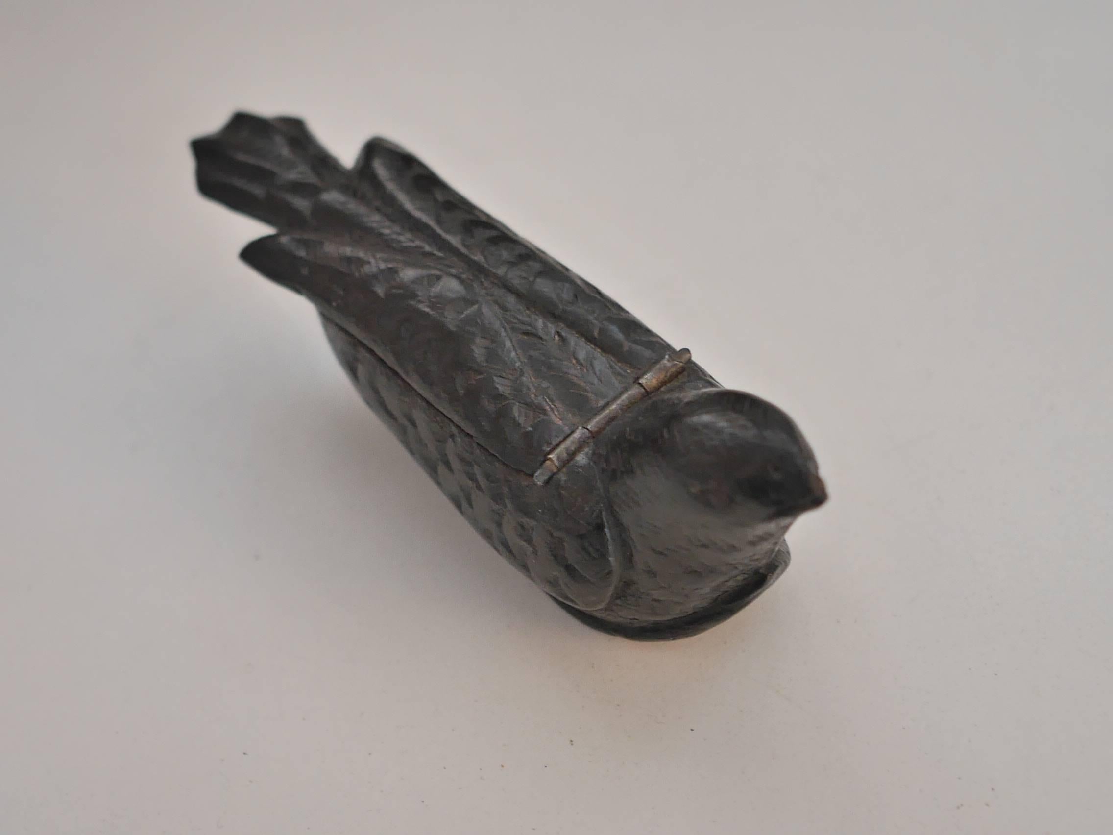 Unique walnut-tree snuffbox, carved as a bird but the bottom part also features a sabot (a kind of simple shoe, shaped and hollowed out from a single block of wood, traditionally worn by French and Breton peasants). 
The engraving work is