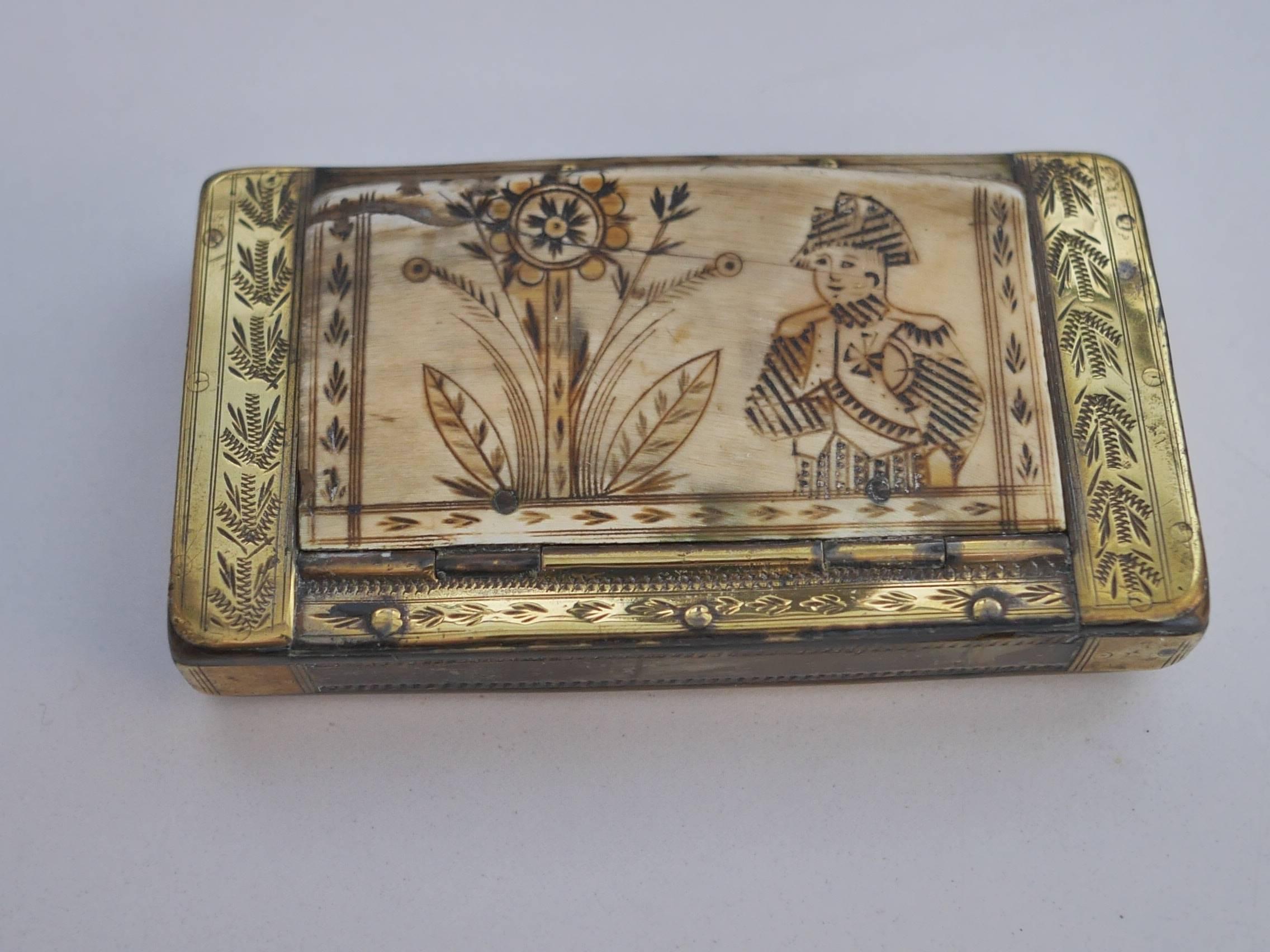 Beautifully carved horn snuffbox, representing Napoleon on one side, a eight branch star on the other side. 
The hinge is made of brass, as for the setting, beautifully decorated. 

Inhaling snuff, or snuffing, as it is also called, was first