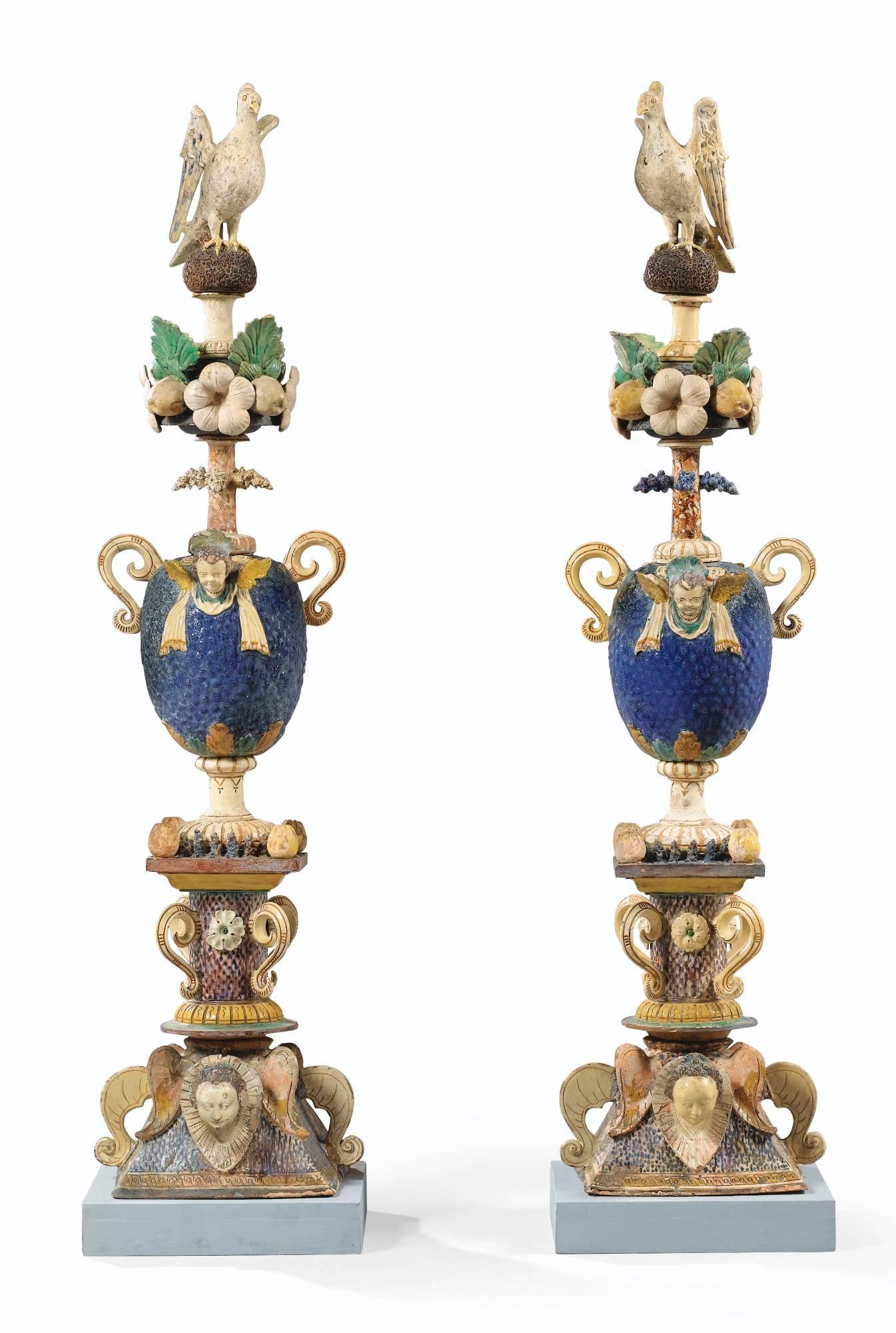 Unique pair of polychrome finials, composed of eight parts decorated with flowers, birds, leaves and faces. It was manufactured in Pré d'Auge, Normandie. 

A similar Item is exposed at the Musée de la Renaissance and at the Petit Palais in Paris.