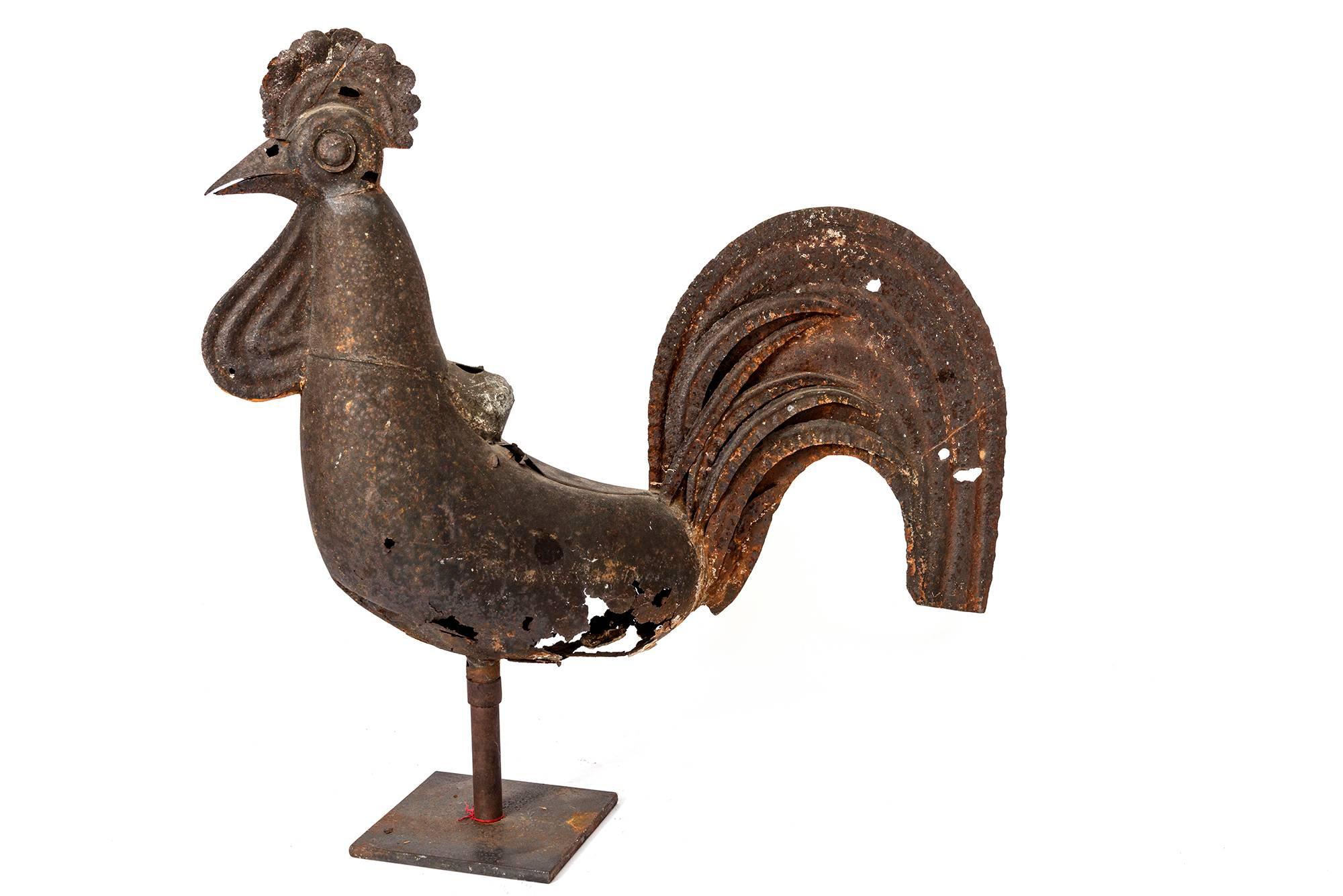 A distressed yet interesting rendition of a chicken on a stand from France.