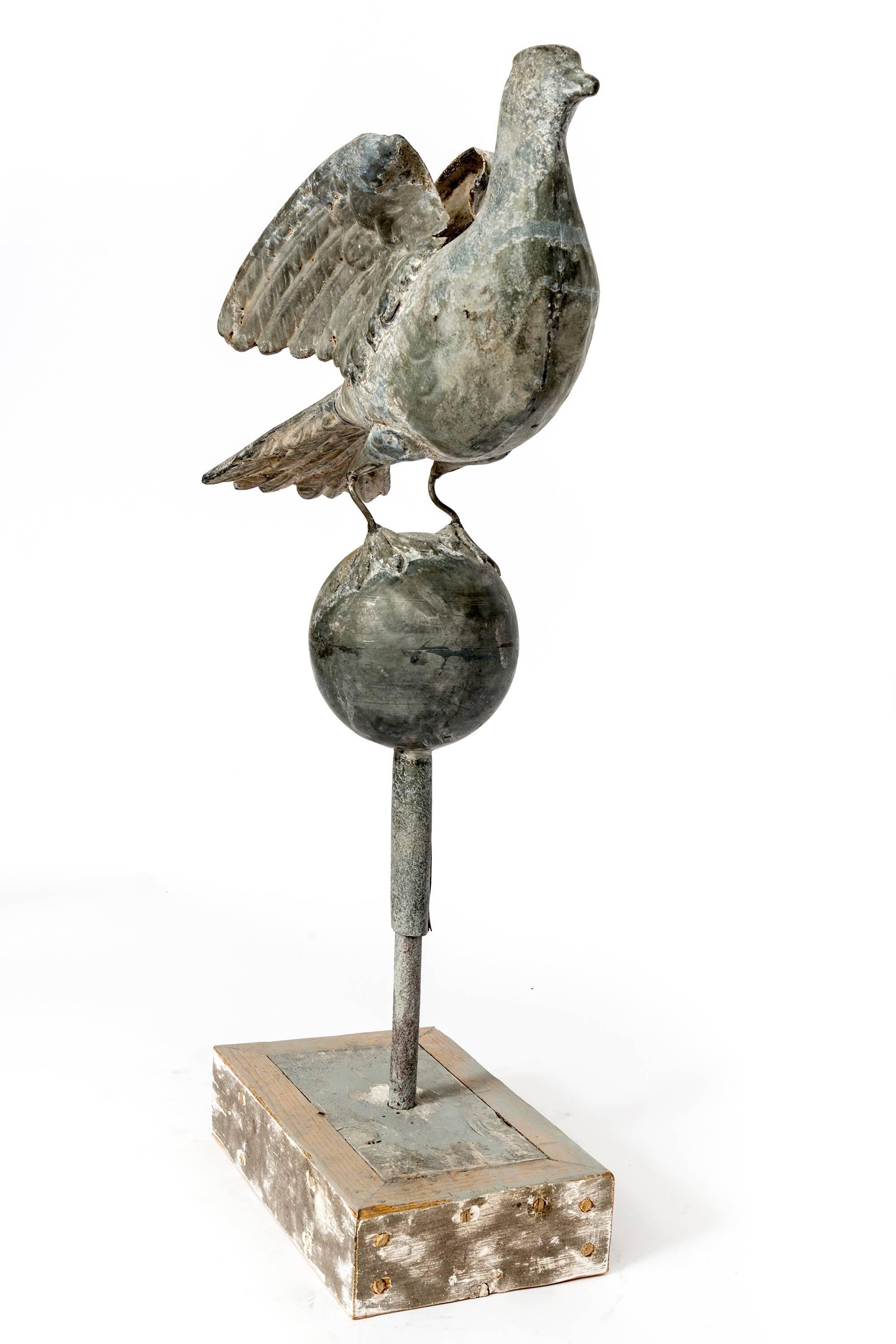 Hand-Carved Tall Zinc Bird on Globe with Stand For Sale