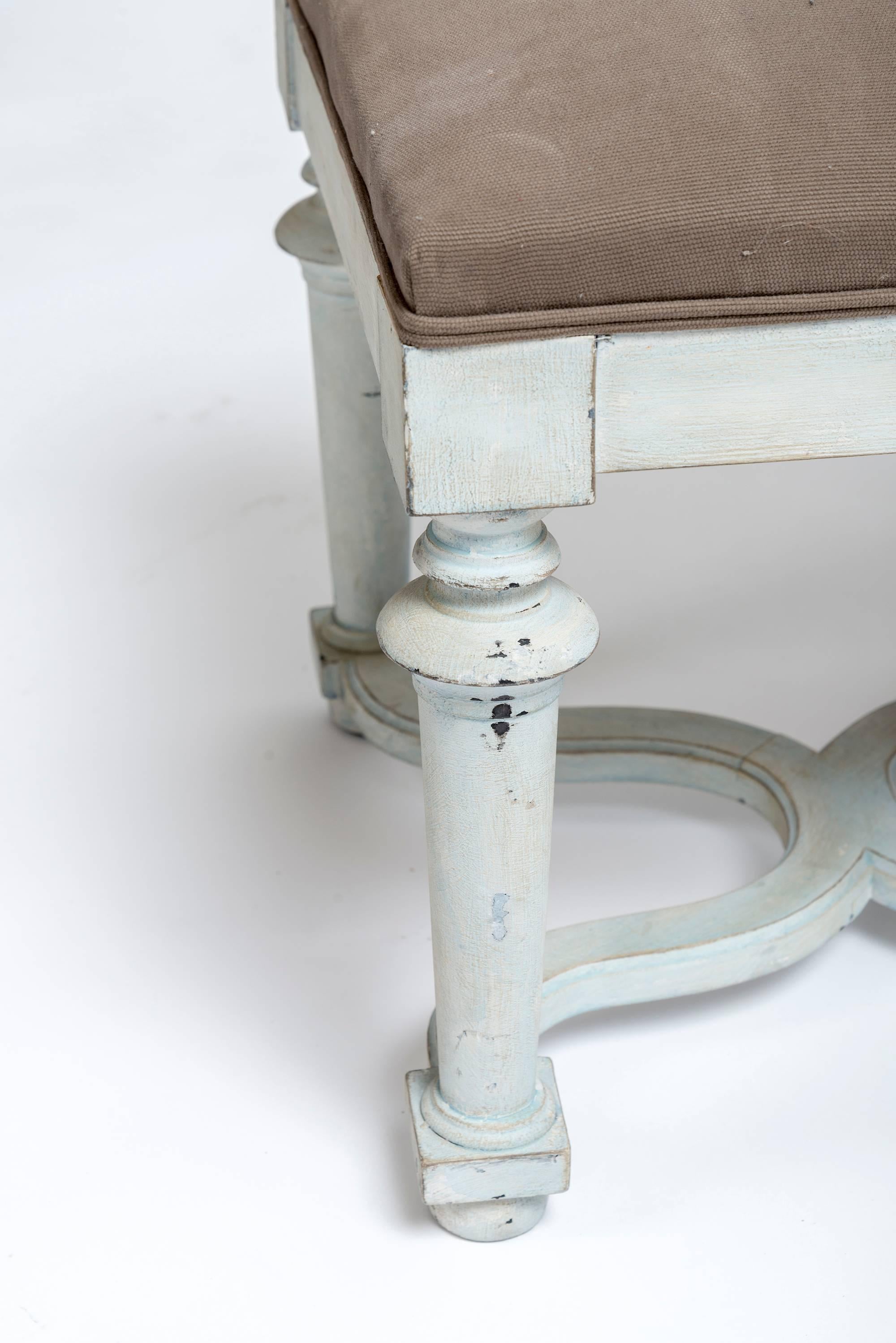 An unusual pair of painted benches with new upholstery, circa 1890 from France. These benches would go beautifully with the Light green console tables with the dark rose-colored marble top and the Piedmont mirrors. A whimsical base makes these an