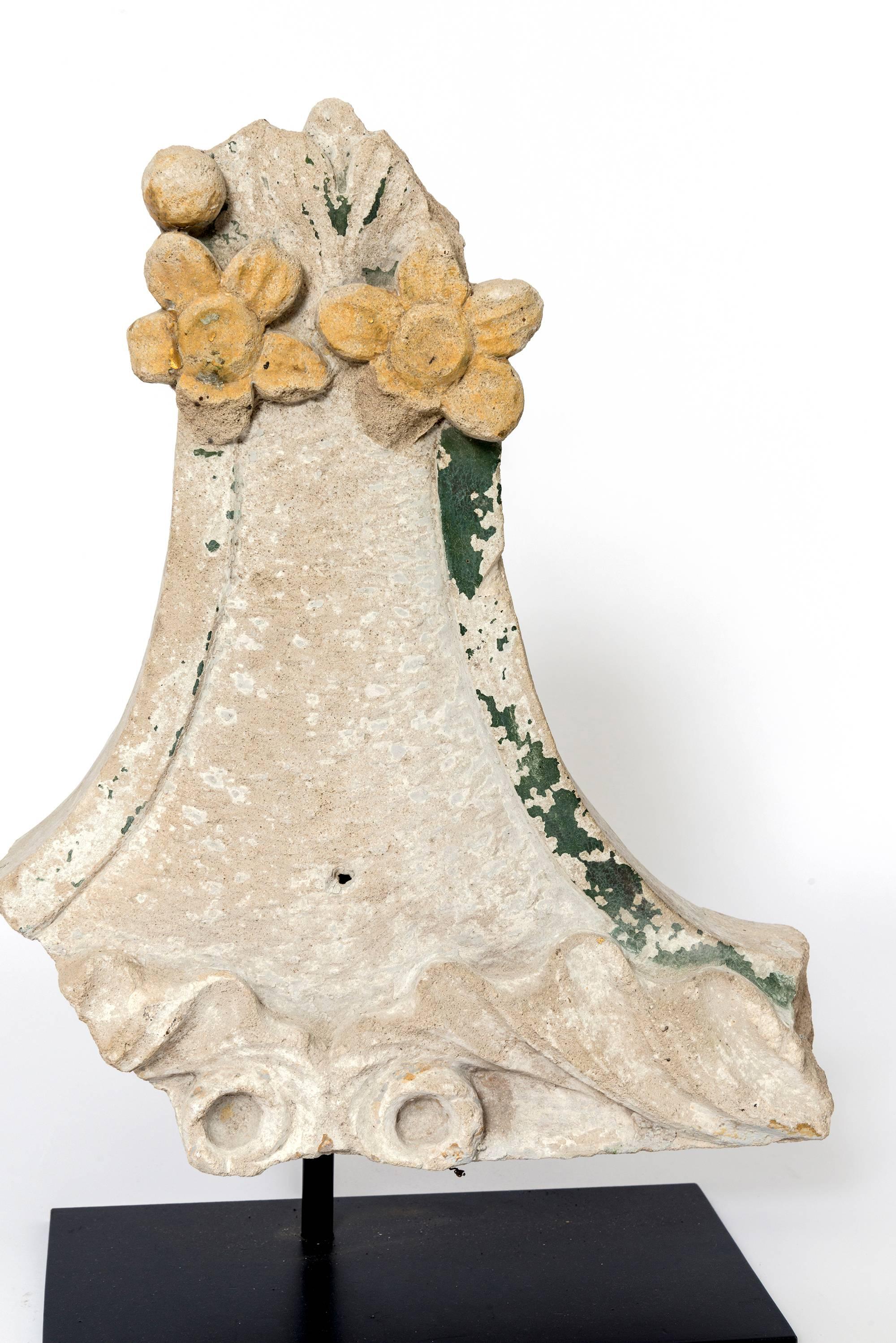 These are a wonderful display of varying floral patterns carved in stone with a goldenrod and green patina remaining on these. Various shapes and dimensions on these as a cluster look fantastic displayed together or separately.