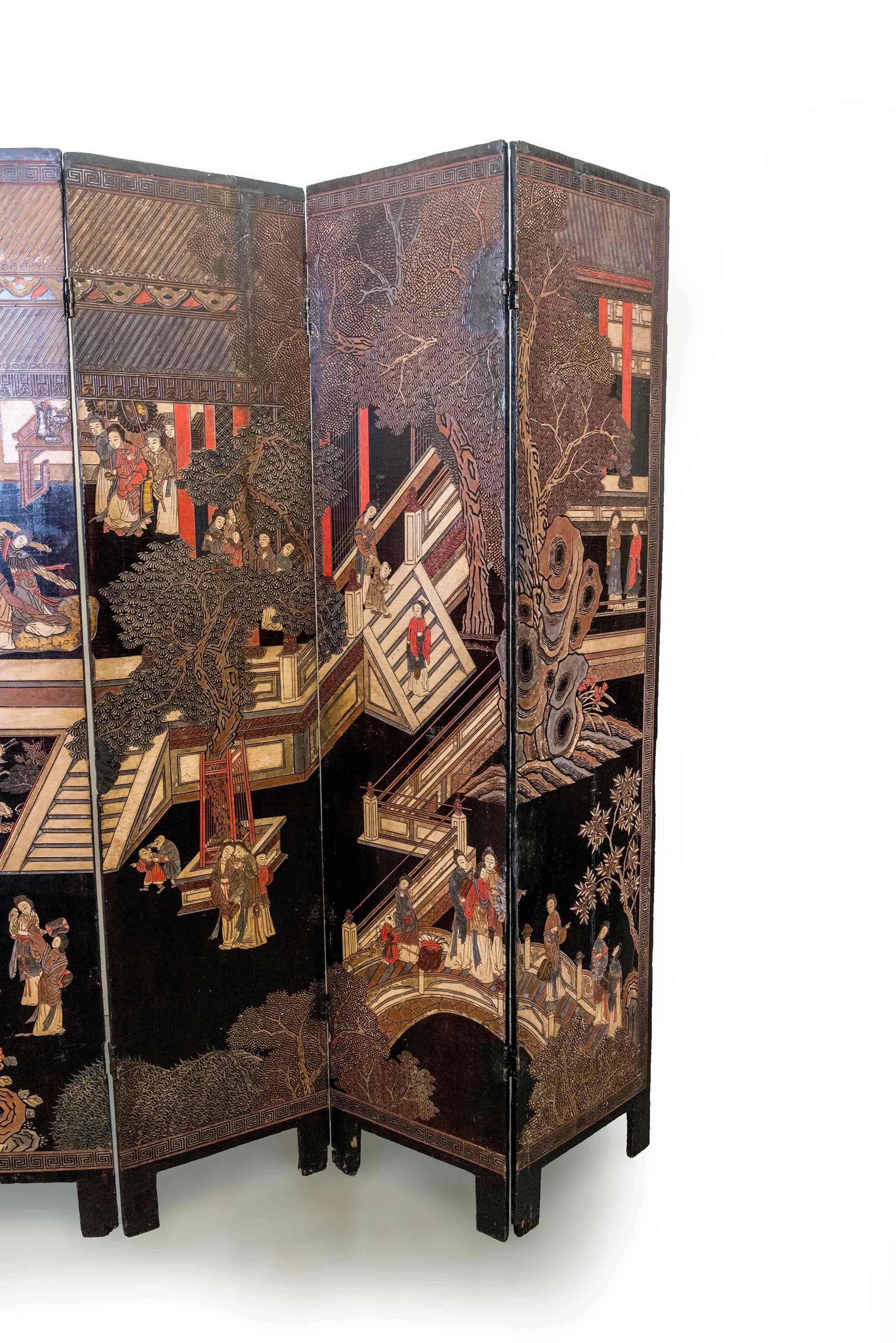 Chinese Coromandel Screen with Carved Asian Paintings and Written Characters