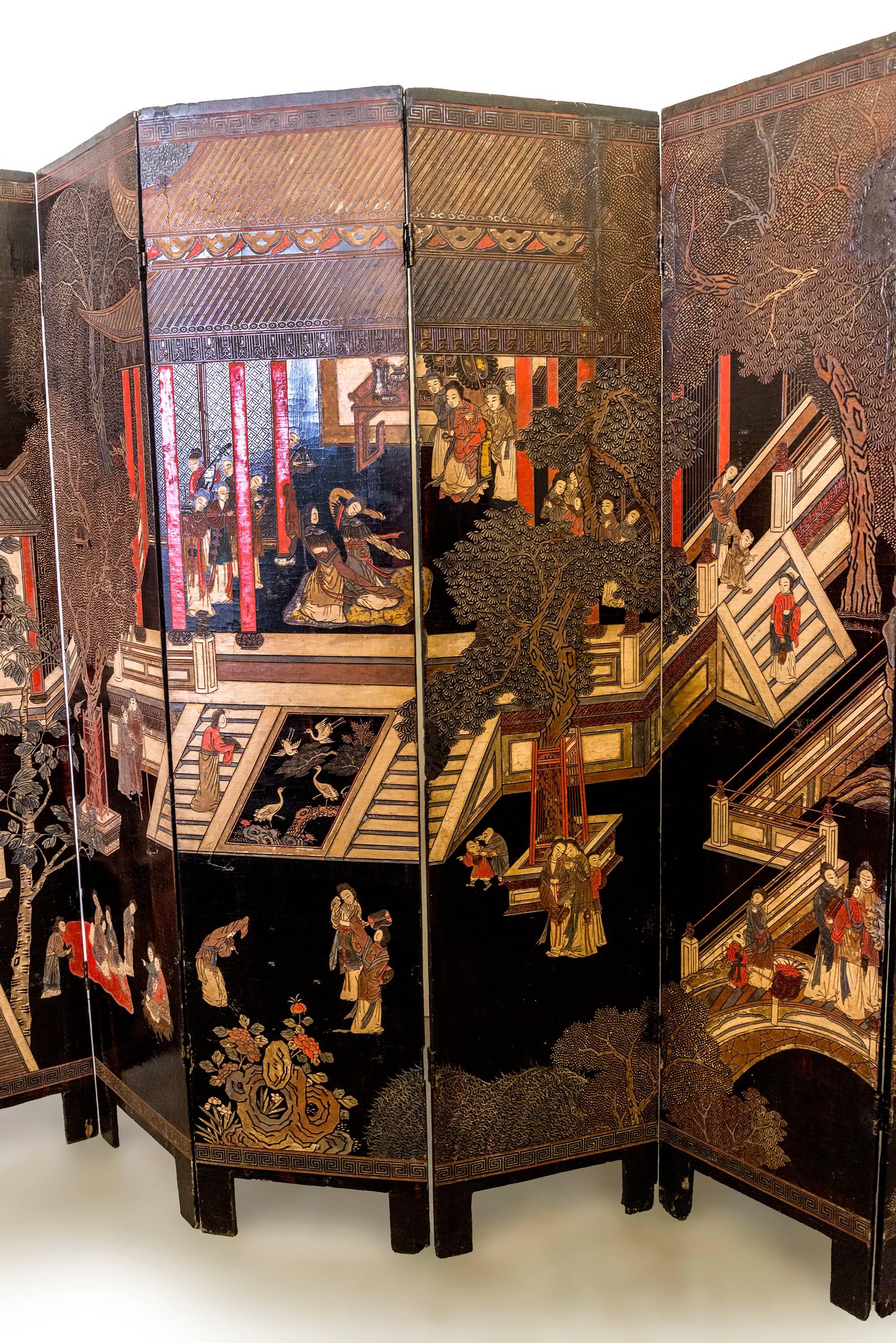 Coromandel Screen with Carved Asian Paintings and Written Characters In Excellent Condition In Los Angeles, CA