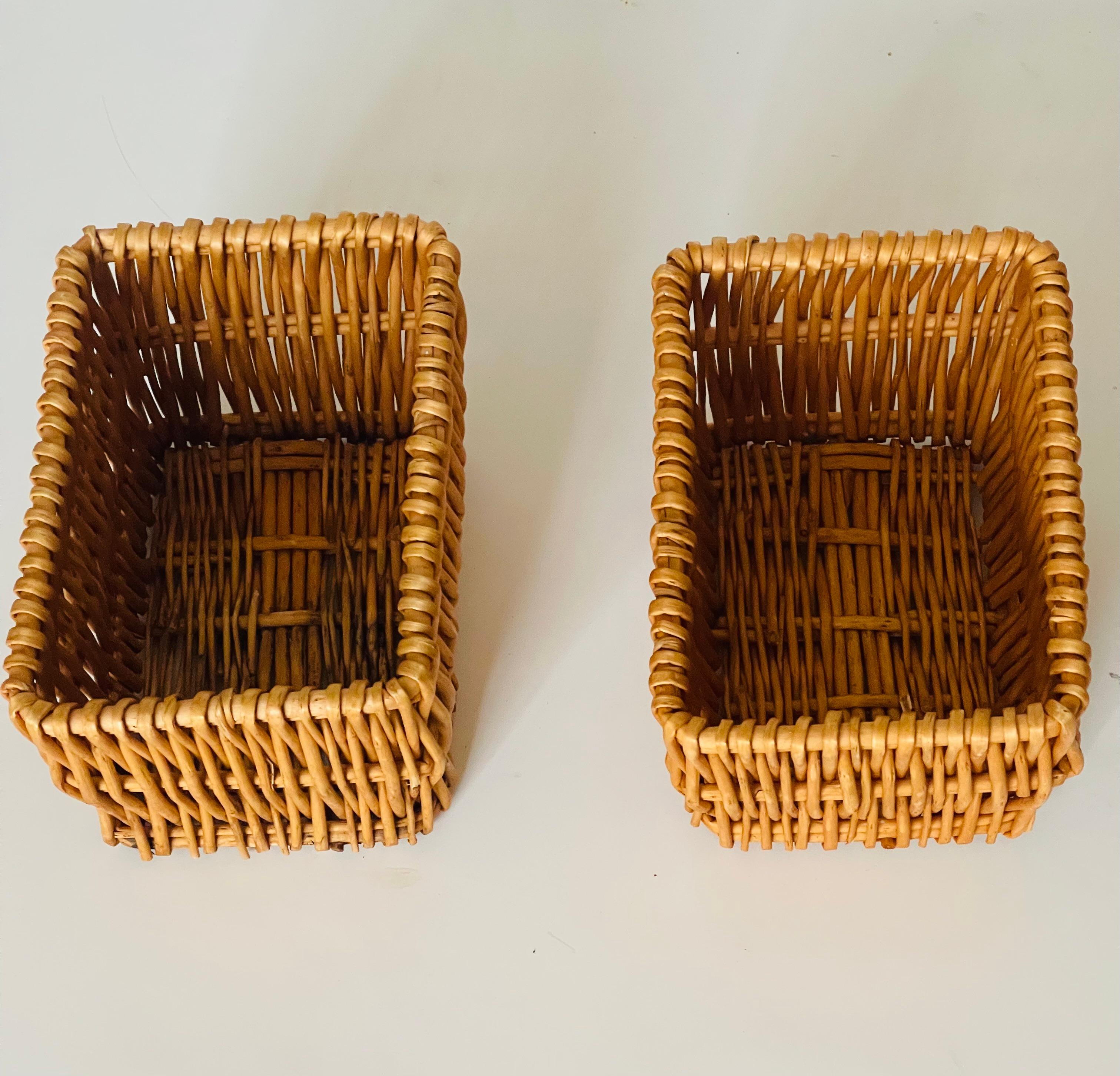 Cute pair of small vintage handmade wicker baskets.