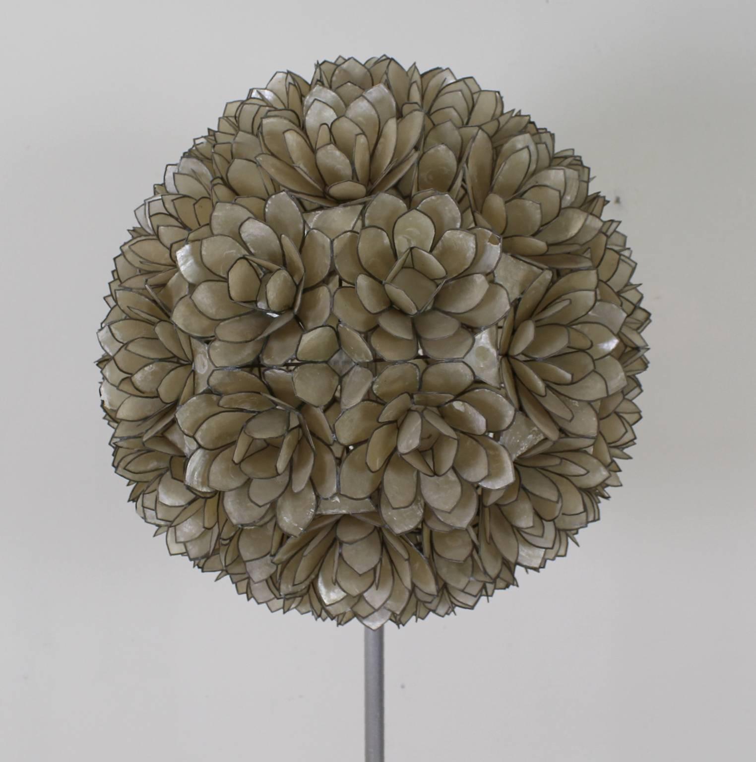 Flower ball mother-of-pearl floor lamp, 1970. 
Lotus floor lamp, shade made of thin pearl leaves 
(a few leaves have some damage).
Supported on a metal upright stem. 
The base is covered with mica. 
Provides a nice atmospheric subtle light.