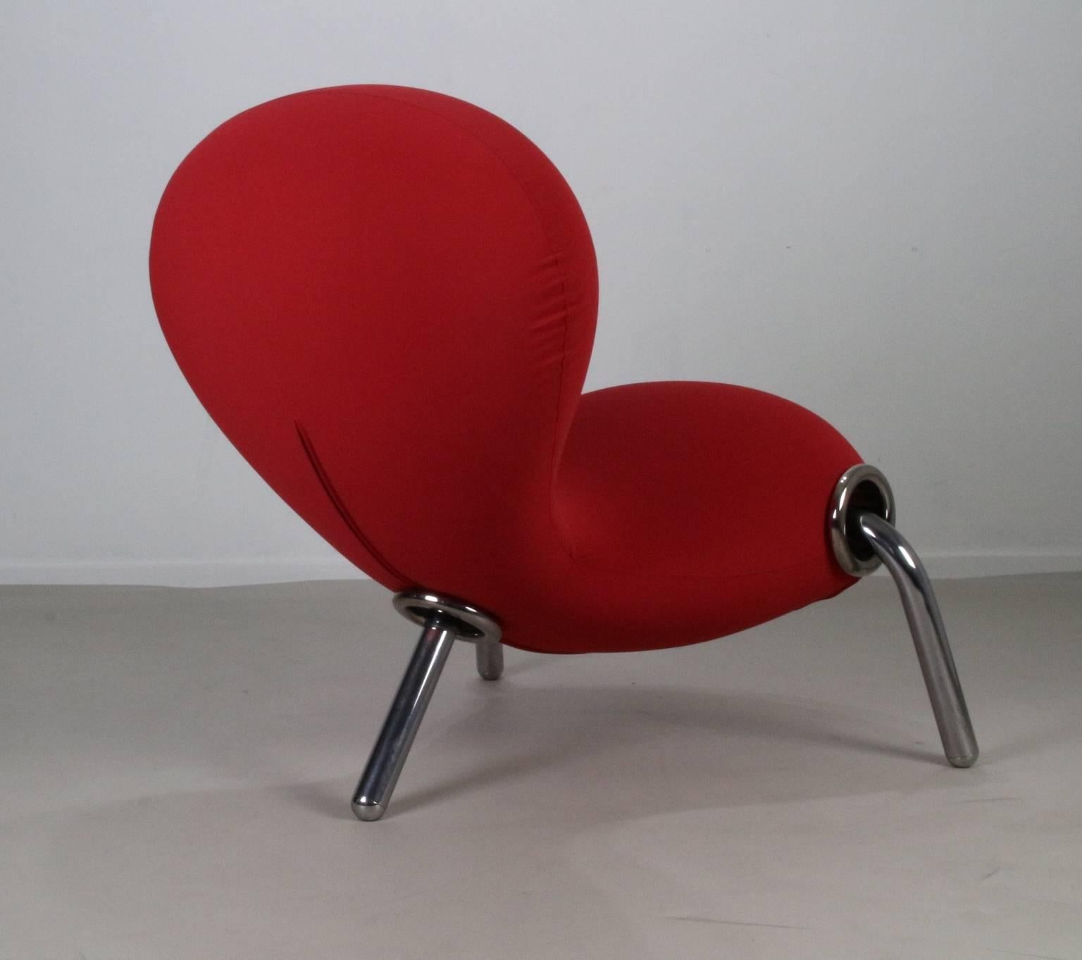 The embryo chair a design Icon
Designer: Marc Newson 1988.
Manufacturer: Cappellini Italy.
Chromed steel base and red synthetic fabric upholstery.
Australian designer.
 