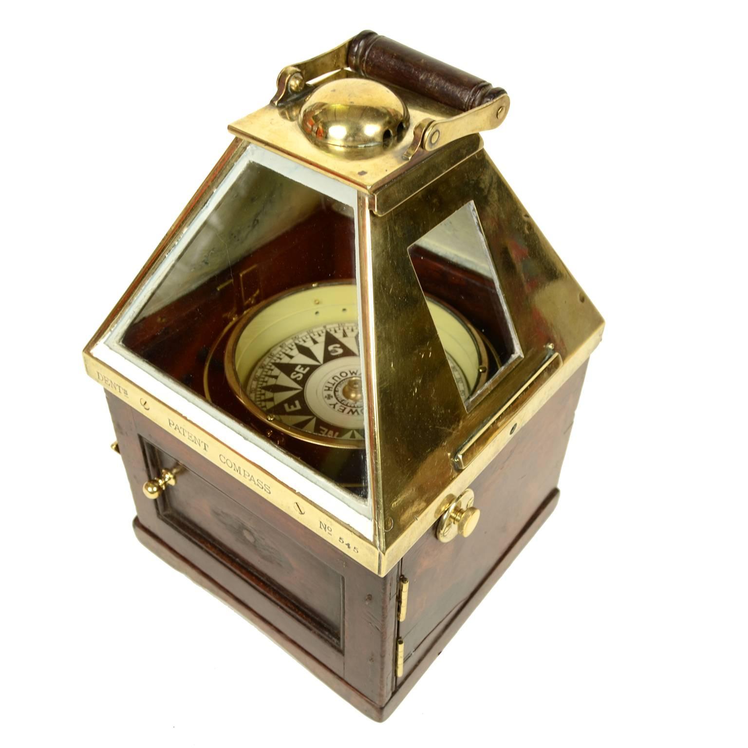 Rare and elegant binnacle compass made of mahogany and brass signed DENT's Patent COMPASS no. 545 with handle for transportation. Inside there is a dry compass signed J. Blowey plymouth mounted on universal joint placed in a mahogany case topped