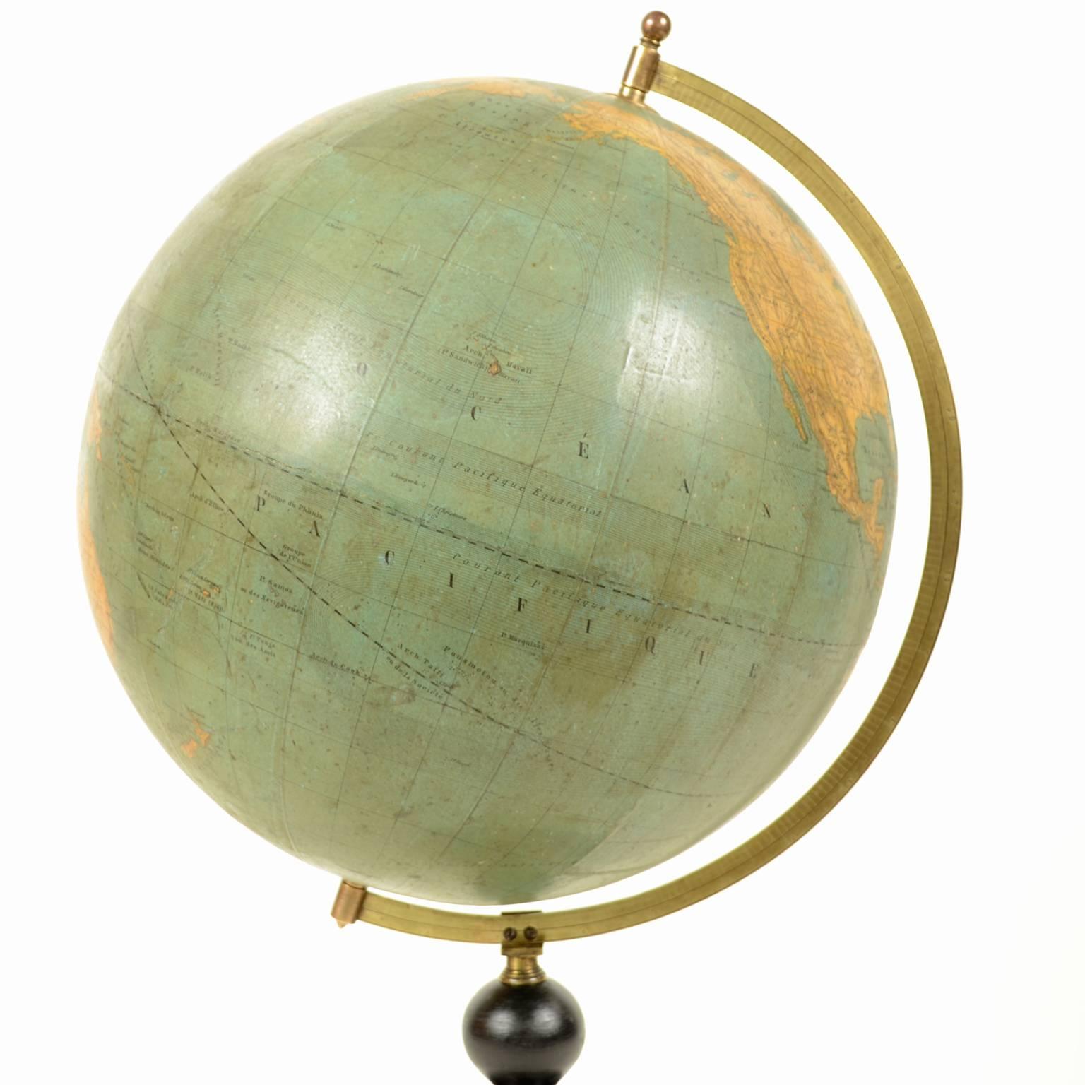 Terrestrial globe edited in the mid-19th century in Paris by M. Vivien de Saint Martin. There are territorial maps and oceanic currents. Turned and ebonized wooden base, papier mâché sphere. Good condition. Height cm 58.5, diameter of sphere cm 30.