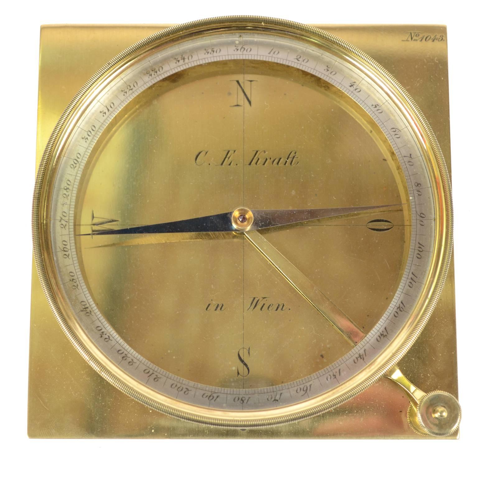 Brass topographic compass signed C.E Kraft in Wien placed in its original wooden box, second half of the 19th century. The compass is complete with a goniometric circle engraved from 10° to 360° and equipped with needle lock for the calculation of