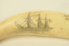 Sperm whale tooth scrimshaw engraved with a whaling ship at sea, 19th century