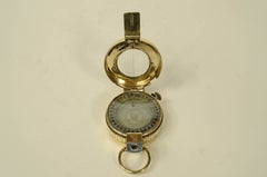 Prismatic surveying compass signed T.G. Co. Ltd. London, 1942