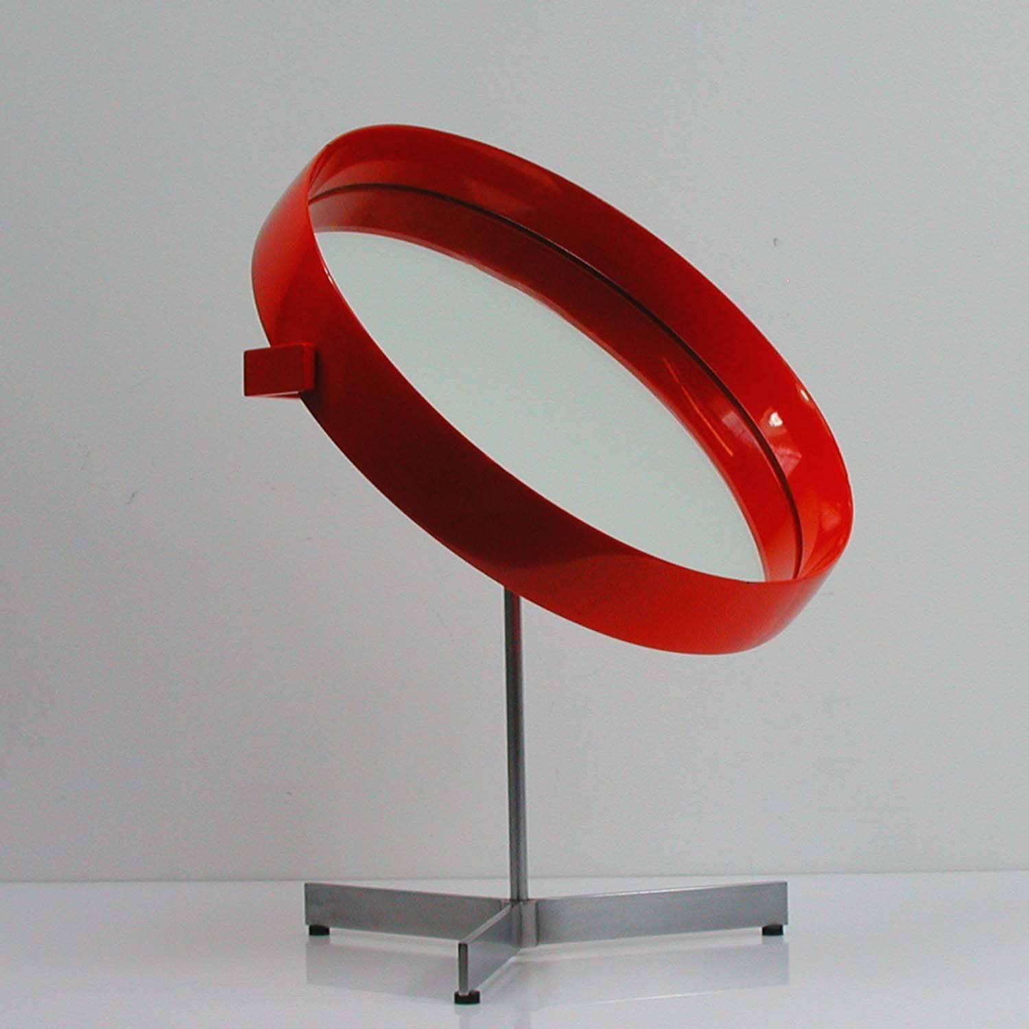 Very rare red table mirror by Uno and Osten Kristiansson for Luxus Vittsjö, made in Sweden in the 1960s.
The mirror has hot a red lacquered frame and a steel tripod foot. The mirror is adjustable.
 