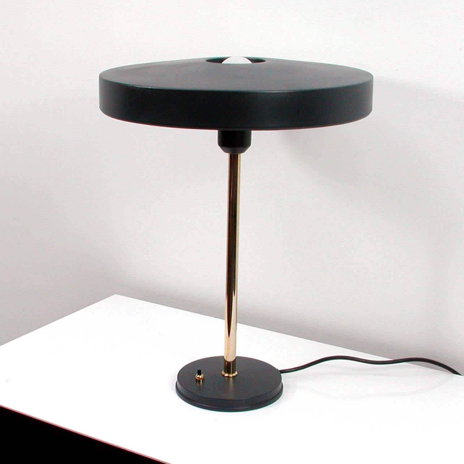 This Mid-Century table lamp was manufactured in the 1970s by Philips in the Netherlands and designed by Louis Christian Kalff. The model is 